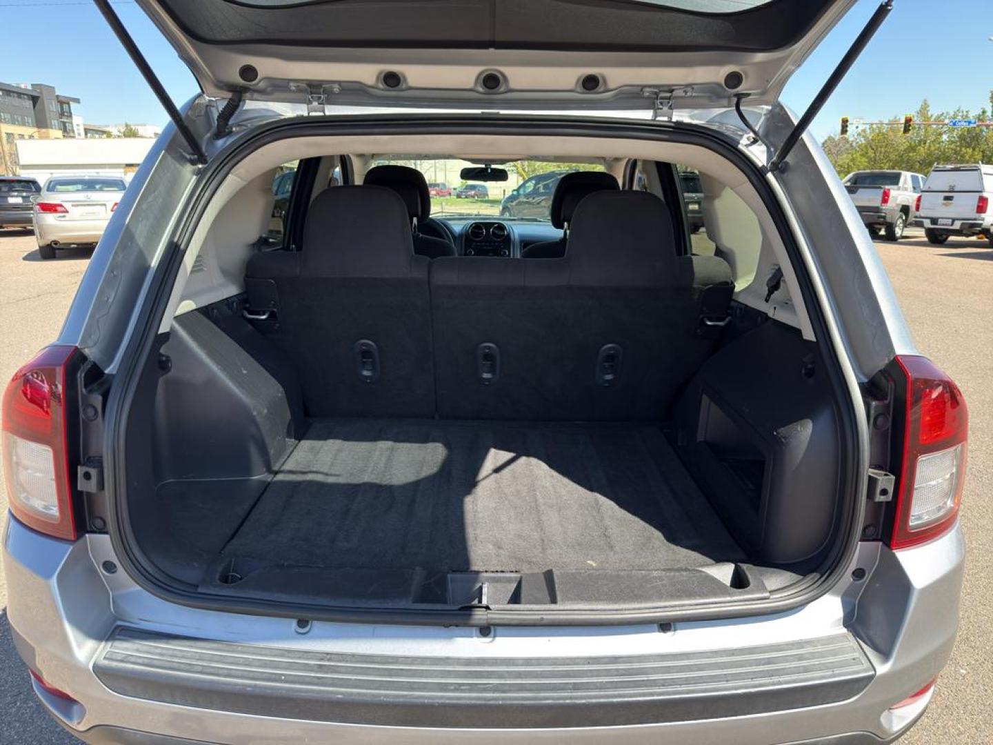 2015 SILVER Jeep Compass Sport (1C4NJDBB9FD) with an 4 Cyl, 2.4L engine, Automatic transmission, located at 10890 W. Colfax Ave., Lakewood, CO, 80215, (303) 274-7692, 39.739914, -105.120132 - Photo#11