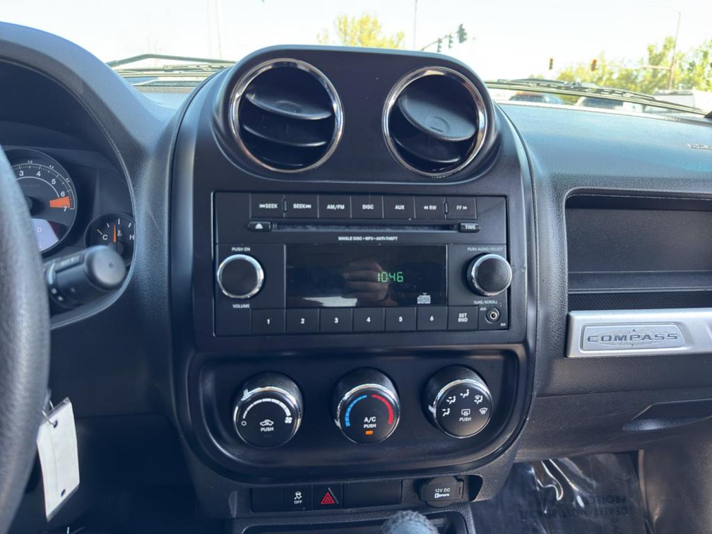 2015 SILVER Jeep Compass Sport (1C4NJDBB9FD) with an 4 Cyl, 2.4L engine, Automatic transmission, located at 10890 W. Colfax Ave., Lakewood, CO, 80215, (303) 274-7692, 39.739914, -105.120132 - Photo#16
