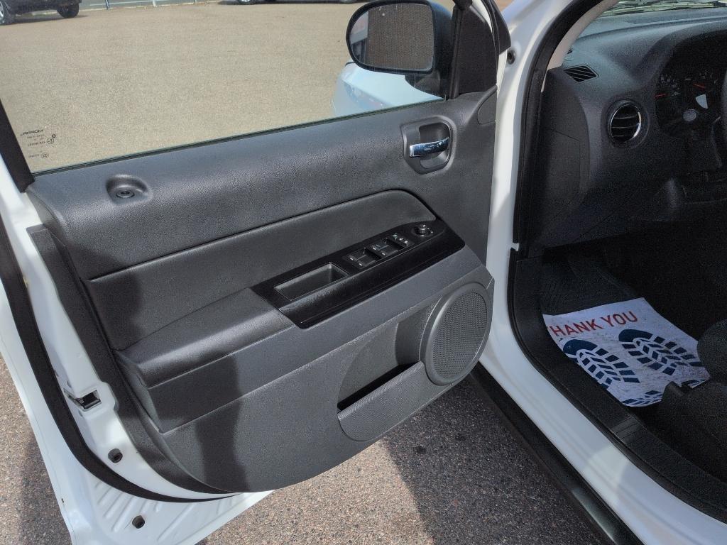 2011 WHITE Jeep Compass Sport (1J4NT1FA7BD) with an 4 Cyl, 2.0L engine, Manual transmission, located at 10890 W. Colfax Ave., Lakewood, CO, 80215, (303) 274-7692, 39.739914, -105.120132 - Photo#8