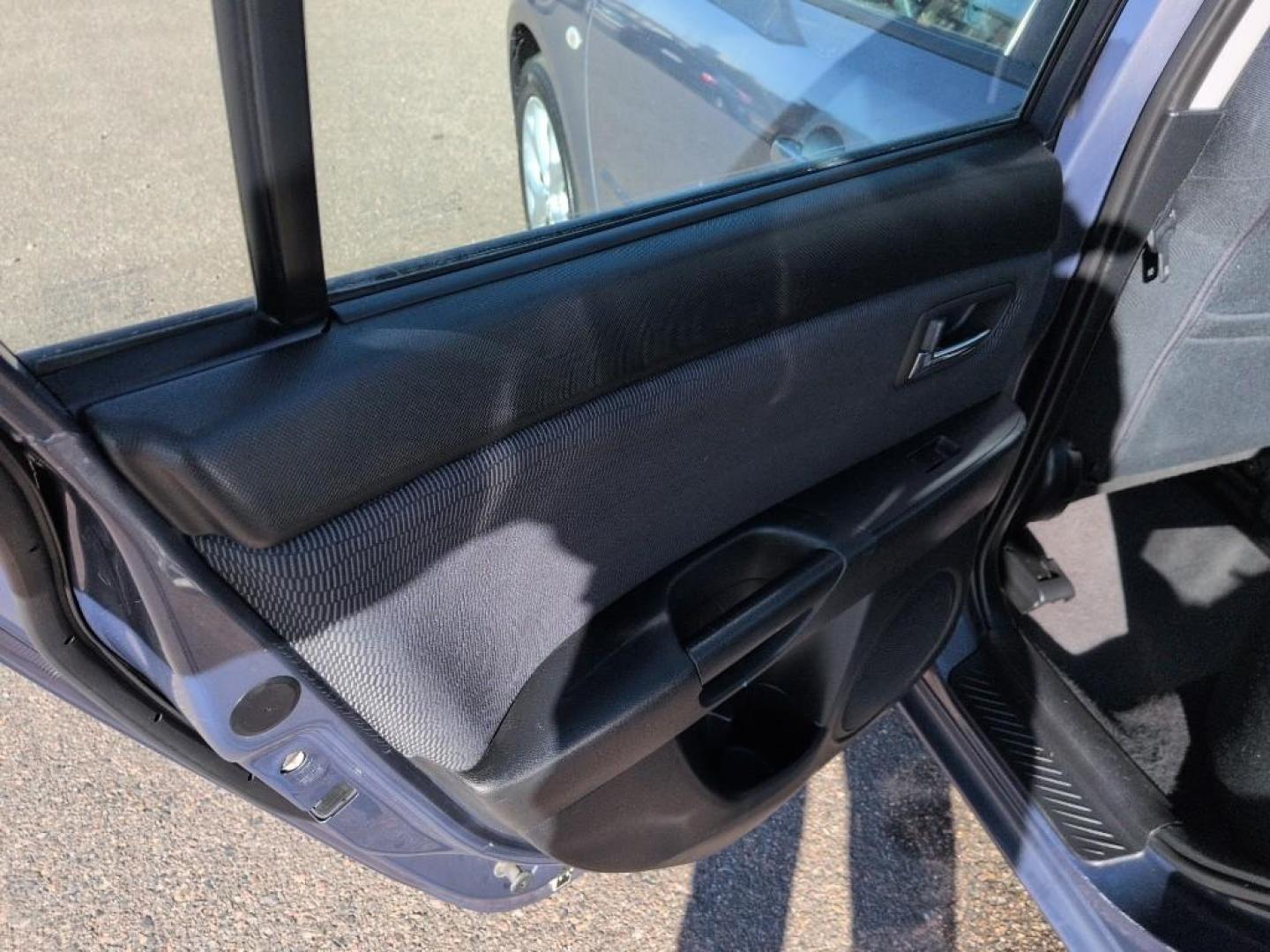 2009 GRAY Mazda Mazda3 i (JM1BK32FX91) with an 4 Cyl, 2.0L engine, Manual 5-Speed transmission, located at 10890 W. Colfax Ave., Lakewood, CO, 80215, (303) 274-7692, 39.739914, -105.120132 - Photo#14