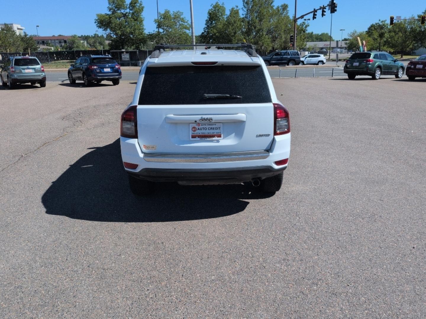 2014 WHITE Jeep Compass Limited (1C4NJCCB5ED) with an 4 Cyl, 2.4L engine, Automatic transmission, located at 10890 W. Colfax Ave., Lakewood, CO, 80215, (303) 274-7692, 39.739914, -105.120132- Photo#5