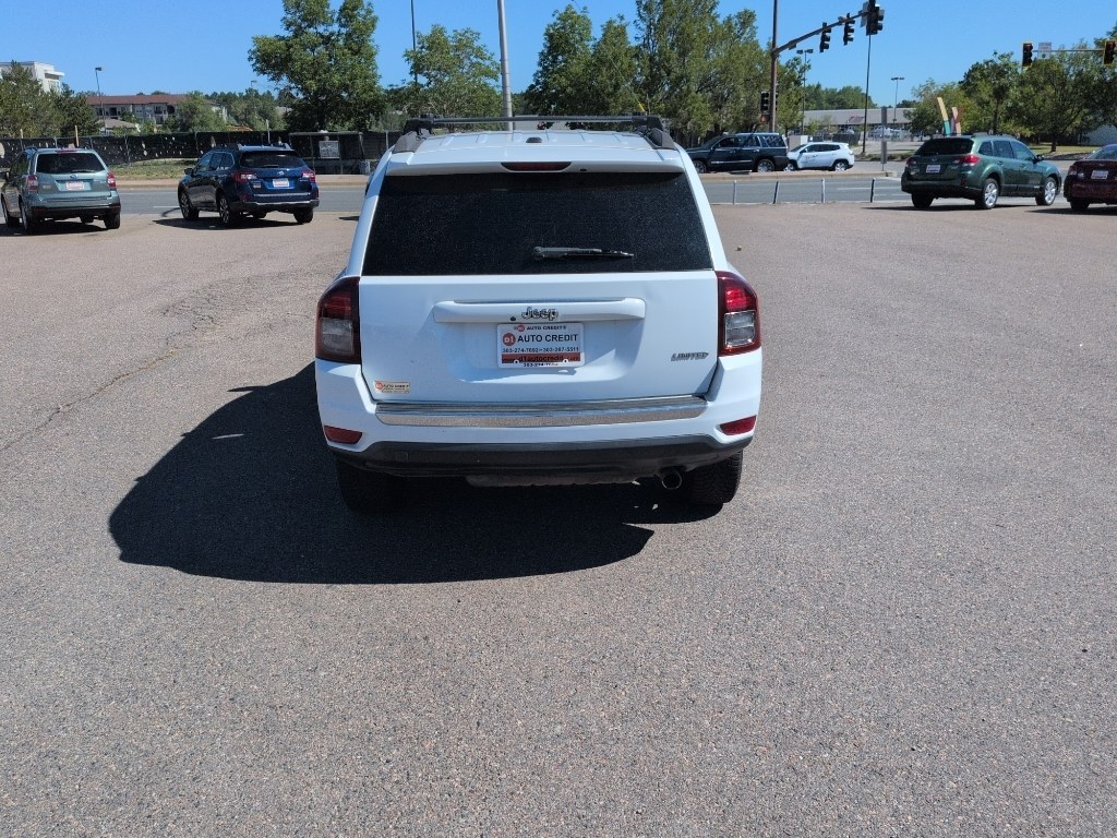 2014 WHITE Jeep Compass Limited (1C4NJCCB5ED) with an 4 Cyl, 2.4L engine, Automatic transmission, located at 10890 W. Colfax Ave., Lakewood, CO, 80215, (303) 274-7692, 39.739914, -105.120132- Photo#5