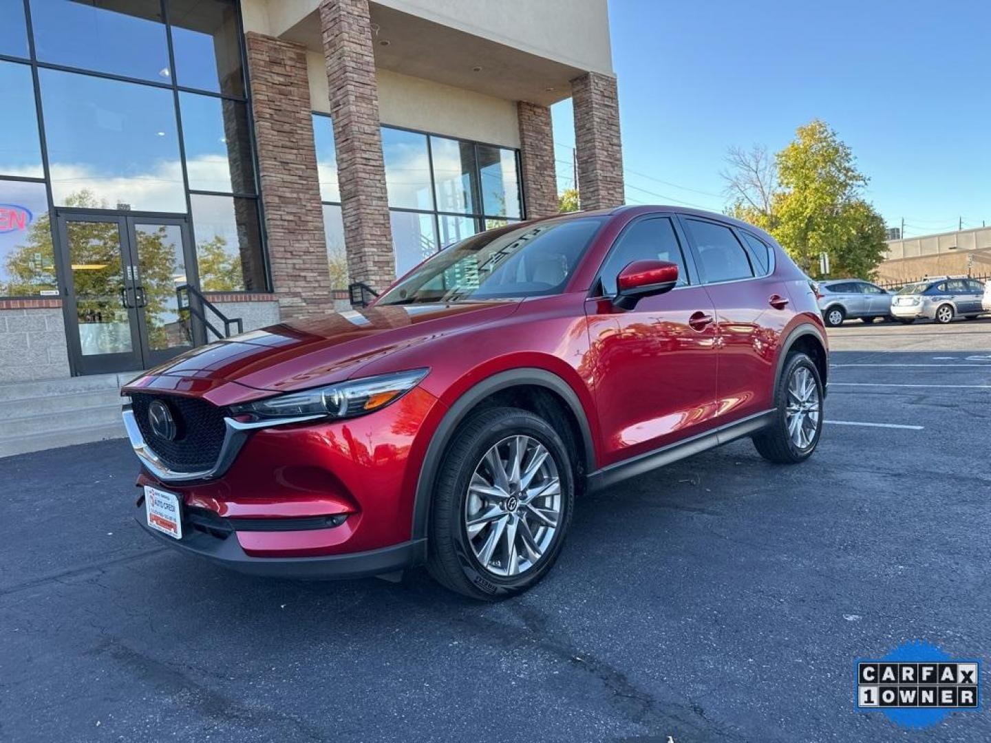 2019 Soul Red Crystal Metallic /Parchment Mazda CX-5 Grand Touring Reserve (JM3KFBDYXK0) with an 2.5L 4-Cylinder engine, Automatic transmission, located at 10890 W. Colfax Ave., Lakewood, CO, 80215, (303) 274-7692, 39.739914, -105.120132 - 2019 Mazda CX-5 Grand Touring Reserve in mint condition! Loaded with heated leather seats, heated steering wheel, heads up display, Apple/Android Carplay, panoramic roof, Bose speakers and more. <br><br>All Cars Have Clean Titles And Are Serviced Before Sale.<br>Apple/Android Car Play, All Books and - Photo#1