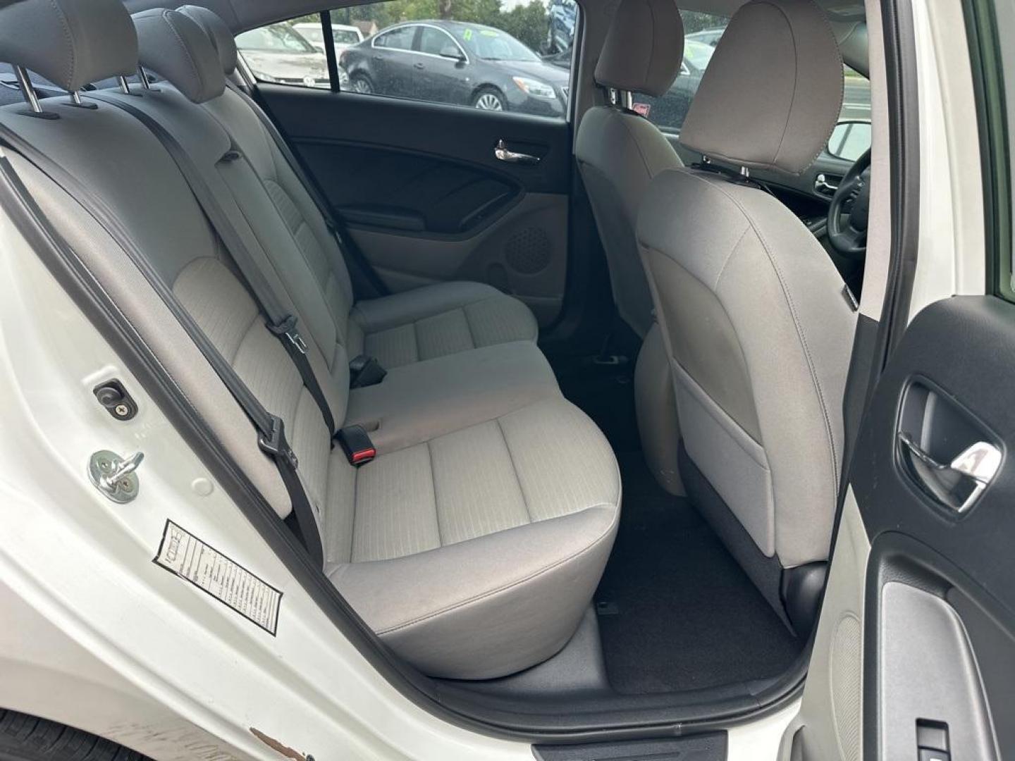 2016 Snow White Pearl /Gray Kia Forte LX (KNAFX4A64G5) with an 1.8L I4 DOHC Dual CVVT engine, Automatic transmission, located at 10890 W. Colfax Ave., Lakewood, CO, 80215, (303) 274-7692, 39.739914, -105.120132 - 2016 Kia Forte<br><br>D1 Auto NEVER charges dealer fees! All cars have clean titles and have been inspected for mechanical issues. We have financing for everyone. Good credit, bad credit, first time buyers.<br><br>Please call Lakewood Location 303-274-7692 or Thornton 303-287-5511 to schedule a test - Photo#16