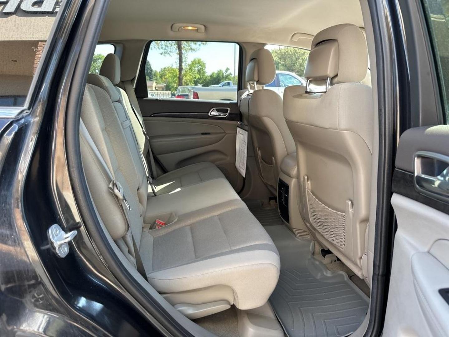 2013 Brilliant Black Crystal Pearlcoat /Dark Graystone/Medium Graystone Jeep Grand Cherokee Laredo (1C4RJFAG1DC) with an 3.6L V6 Flex Fuel 24V VVT engine, Automatic transmission, located at 10890 W. Colfax Ave., Lakewood, CO, 80215, (303) 274-7692, 39.739914, -105.120132 - 2013 Jeep Grand Cherokee<br><br>D1 Auto NEVER charges dealer fees! All cars have clean titles and have been inspected for mechanical issues. We have financing for everyone. Good credit, bad credit, first time buyers.<br>CARFAX One-Owner. Odometer is 6745 miles below market average!<br>Please call La - Photo#9