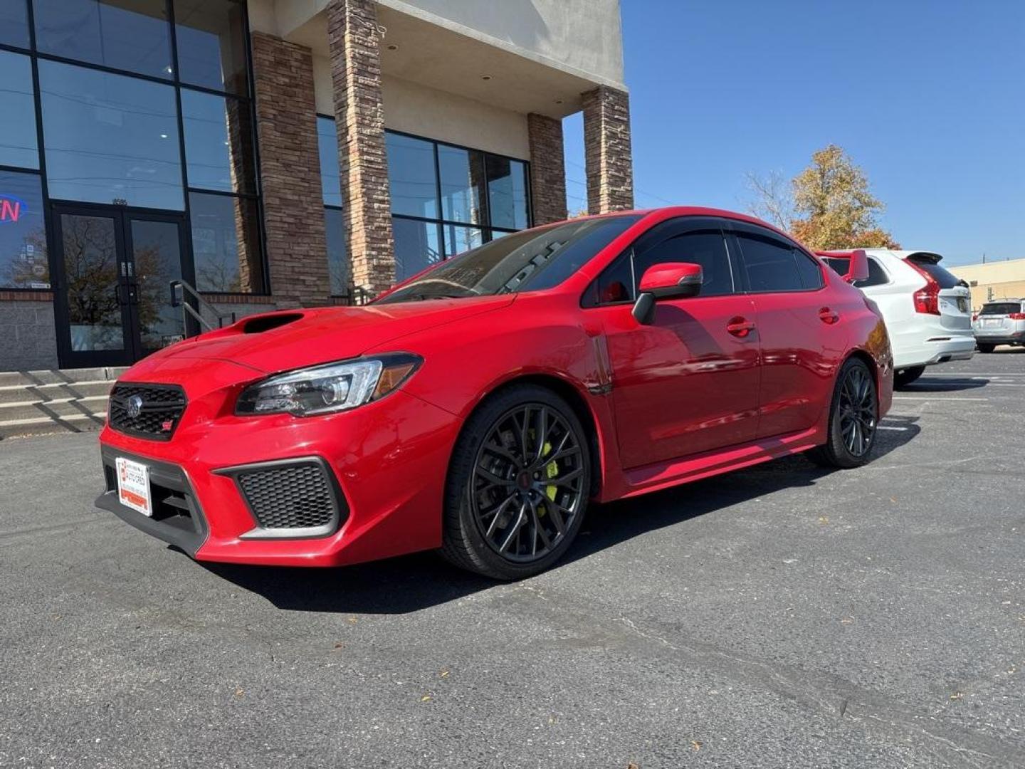 2019 Pure Red /Black/Carbon Black Subaru WRX STi (JF1VA2S64K9) with an 2.5L DOHC Intercooled High Boost Turbocharged engine, Manual transmission, located at 10890 W. Colfax Ave., Lakewood, CO, 80215, (303) 274-7692, 39.739914, -105.120132 - 2019 Subaru WRX STI with low miles and in excellent condition insdie and out!<br>All Cars Have Clean Titles And Are Serviced Before Sale.Apple/Android Car Play, Blind Spot Monitoring, Backup Camera, Leather, Heated Seats, Bluetooth/ With Bluetooth Audio, Non Smoker, No Pet Odor Or Hair, WRX STi, Clo - Photo#0