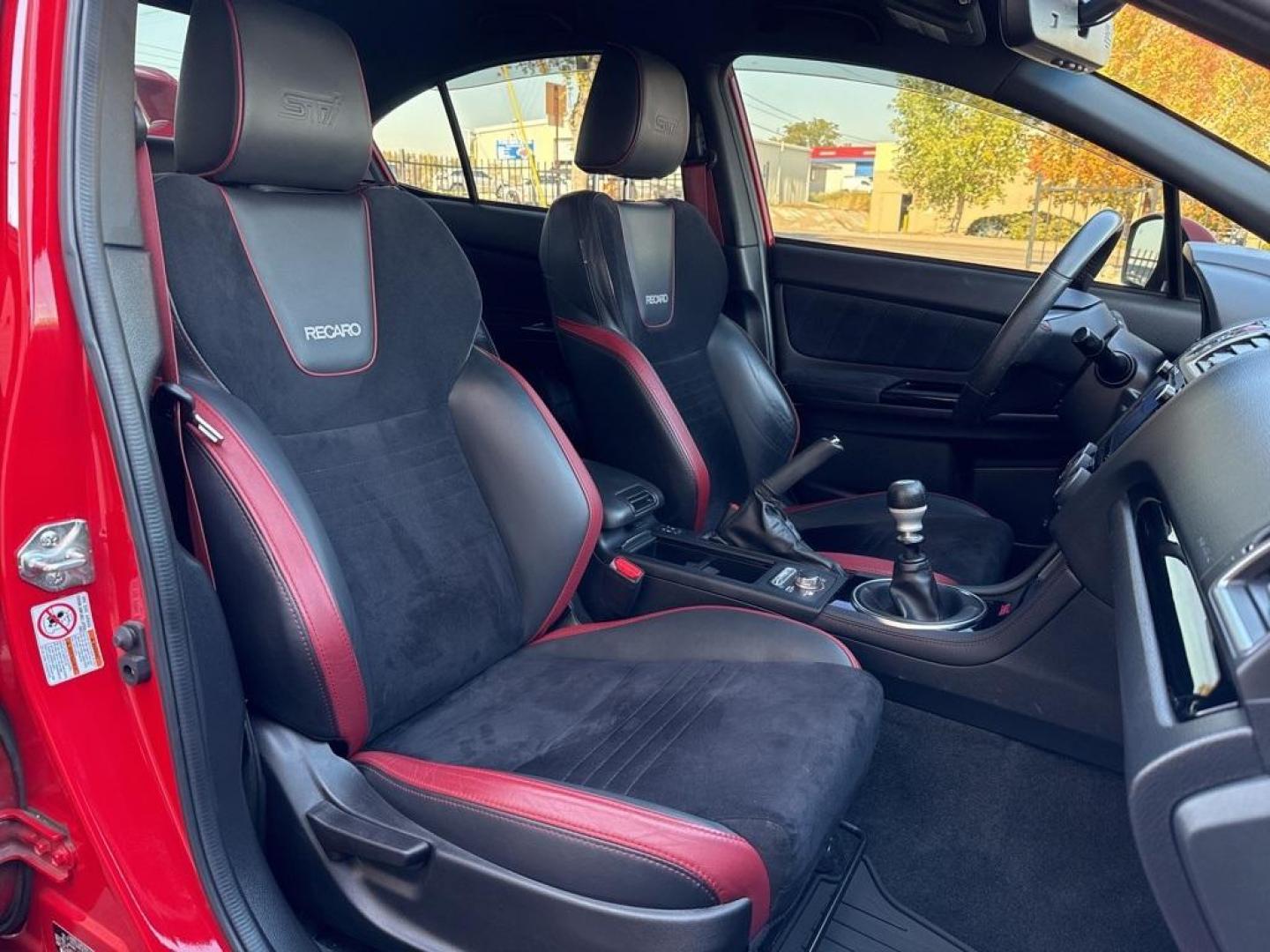 2019 Pure Red /Black/Carbon Black Subaru WRX STi (JF1VA2S64K9) with an 2.5L DOHC Intercooled High Boost Turbocharged engine, Manual transmission, located at 10890 W. Colfax Ave., Lakewood, CO, 80215, (303) 274-7692, 39.739914, -105.120132 - 2019 Subaru WRX STI with low miles and in excellent condition insdie and out!<br>All Cars Have Clean Titles And Are Serviced Before Sale.Apple/Android Car Play, Blind Spot Monitoring, Backup Camera, Leather, Heated Seats, Bluetooth/ With Bluetooth Audio, Non Smoker, No Pet Odor Or Hair, WRX STi, Clo - Photo#11