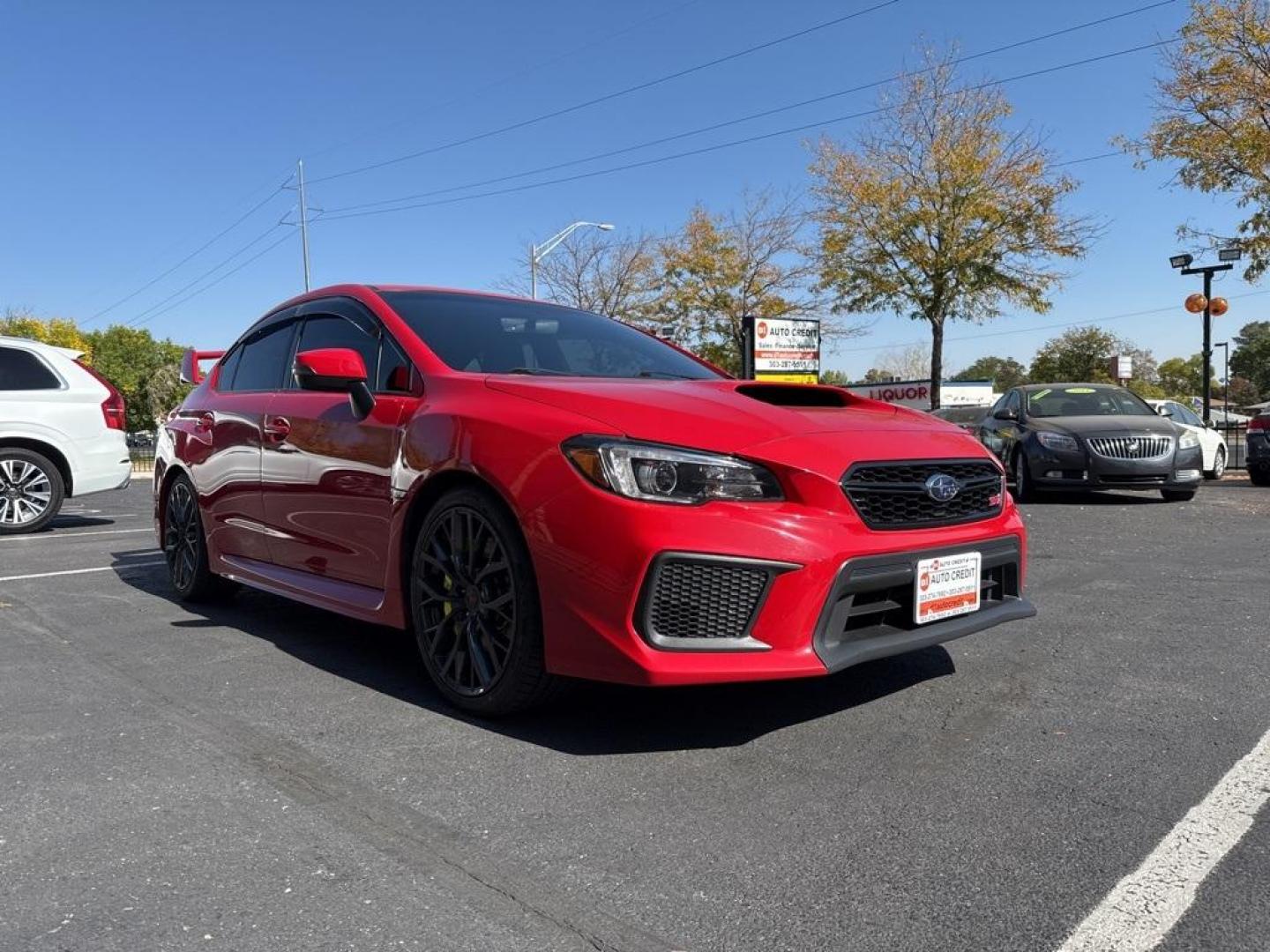 2019 Pure Red /Black/Carbon Black Subaru WRX STi (JF1VA2S64K9) with an 2.5L DOHC Intercooled High Boost Turbocharged engine, Manual transmission, located at 10890 W. Colfax Ave., Lakewood, CO, 80215, (303) 274-7692, 39.739914, -105.120132 - 2019 Subaru WRX STI with low miles and in excellent condition insdie and out!<br>All Cars Have Clean Titles And Are Serviced Before Sale.Apple/Android Car Play, Blind Spot Monitoring, Backup Camera, Leather, Heated Seats, Bluetooth/ With Bluetooth Audio, Non Smoker, No Pet Odor Or Hair, WRX STi, Clo - Photo#2