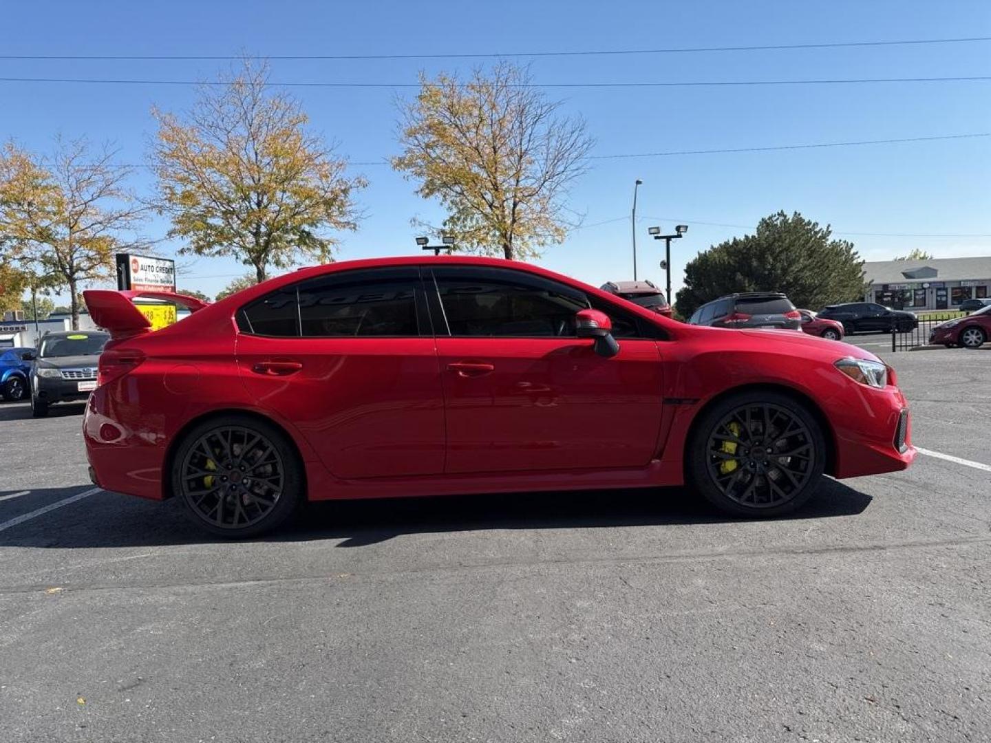 2019 Pure Red /Black/Carbon Black Subaru WRX STi (JF1VA2S64K9) with an 2.5L DOHC Intercooled High Boost Turbocharged engine, Manual transmission, located at 10890 W. Colfax Ave., Lakewood, CO, 80215, (303) 274-7692, 39.739914, -105.120132 - 2019 Subaru WRX STI with low miles and in excellent condition insdie and out!<br>All Cars Have Clean Titles And Are Serviced Before Sale.Apple/Android Car Play, Blind Spot Monitoring, Backup Camera, Leather, Heated Seats, Bluetooth/ With Bluetooth Audio, Non Smoker, No Pet Odor Or Hair, WRX STi, Clo - Photo#4