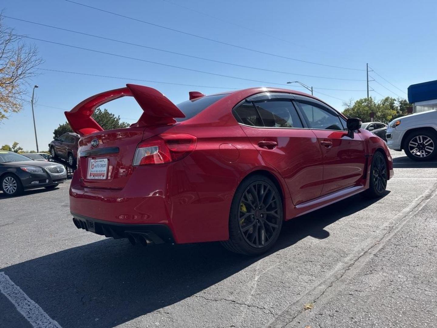 2019 Pure Red /Black/Carbon Black Subaru WRX STi (JF1VA2S64K9) with an 2.5L DOHC Intercooled High Boost Turbocharged engine, Manual transmission, located at 10890 W. Colfax Ave., Lakewood, CO, 80215, (303) 274-7692, 39.739914, -105.120132 - 2019 Subaru WRX STI with low miles and in excellent condition insdie and out!<br>All Cars Have Clean Titles And Are Serviced Before Sale.Apple/Android Car Play, Blind Spot Monitoring, Backup Camera, Leather, Heated Seats, Bluetooth/ With Bluetooth Audio, Non Smoker, No Pet Odor Or Hair, WRX STi, Clo - Photo#5