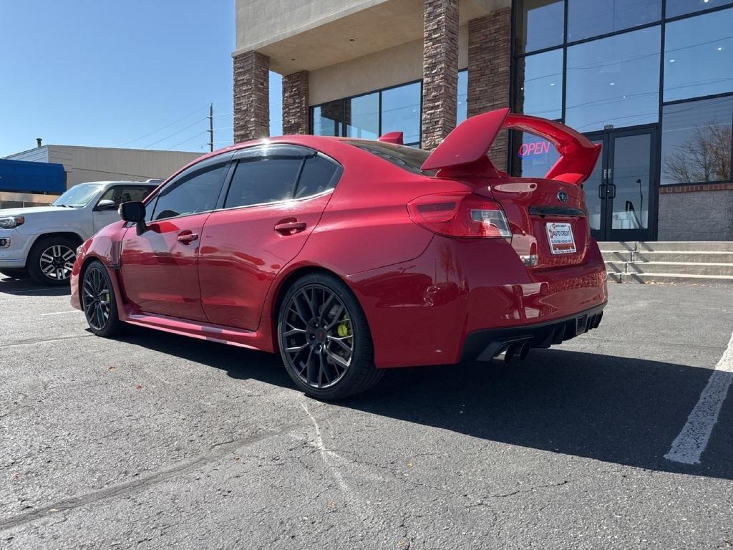 2019 Pure Red /Black/Carbon Black Subaru WRX STi (JF1VA2S64K9) with an 2.5L DOHC Intercooled High Boost Turbocharged engine, Manual transmission, located at 10890 W. Colfax Ave., Lakewood, CO, 80215, (303) 274-7692, 39.739914, -105.120132 - 2019 Subaru WRX STI with low miles and in excellent condition insdie and out!<br>All Cars Have Clean Titles And Are Serviced Before Sale.Apple/Android Car Play, Blind Spot Monitoring, Backup Camera, Leather, Heated Seats, Bluetooth/ With Bluetooth Audio, Non Smoker, No Pet Odor Or Hair, WRX STi, Clo - Photo#7