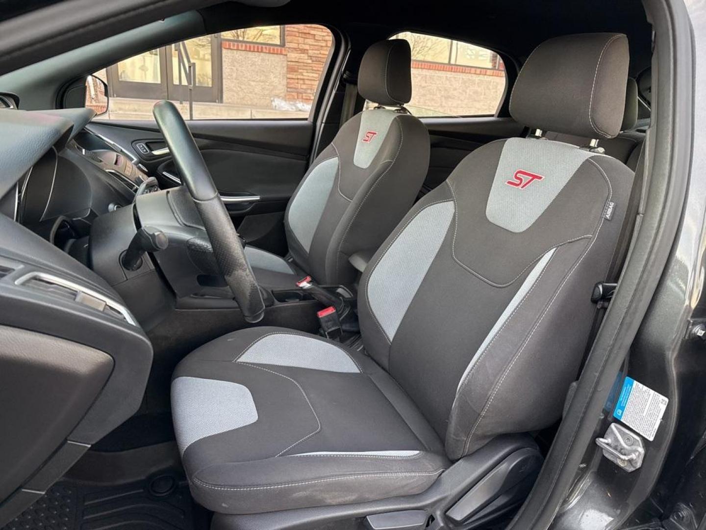 2016 GRAY Ford Focus ST (1FADP3L92GL) with an 4 Cyl, 2.0L engine, Manual transmission, located at 10890 W. Colfax Ave., Lakewood, CO, 80215, (303) 274-7692, 39.739914, -105.120132 - <b>Summary</b><br>Completley stock ST and zero signs of abuse. This is probaly the cleanest one in town. Fully serviced including new turbo and new tires. So much fun to drive! No Accidents and ready to go!<br><br><b>Vehicle Details</b><br>Discover the 2016 Ford Focus ST, a dynamic blend of performa - Photo#49