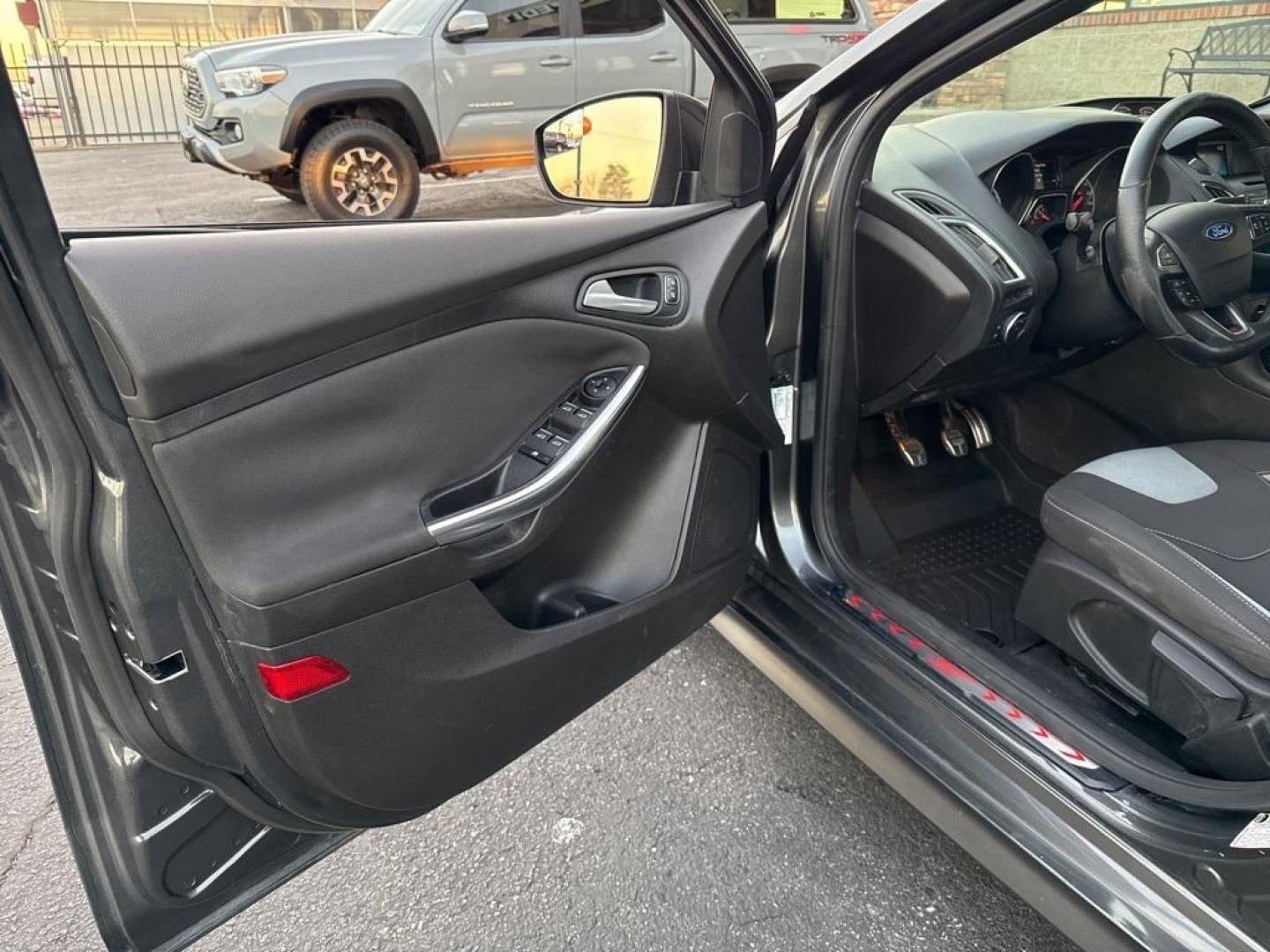 2016 GRAY Ford Focus ST (1FADP3L92GL) with an 4 Cyl, 2.0L engine, Manual transmission, located at 10890 W. Colfax Ave., Lakewood, CO, 80215, (303) 274-7692, 39.739914, -105.120132 - <b>Summary</b><br>Completley stock ST and zero signs of abuse. This is probaly the cleanest one in town. Fully serviced including new turbo and new tires. So much fun to drive! No Accidents and ready to go!<br><br><b>Vehicle Details</b><br>Discover the 2016 Ford Focus ST, a dynamic blend of performa - Photo#67