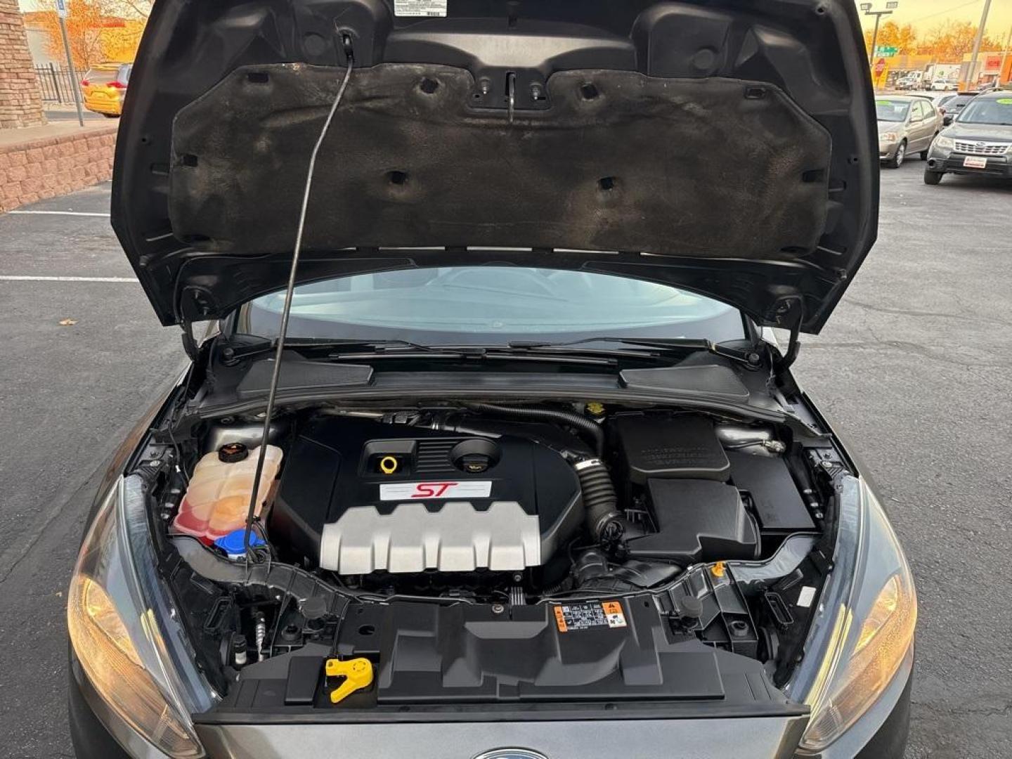 2016 GRAY Ford Focus ST (1FADP3L92GL) with an 4 Cyl, 2.0L engine, Manual transmission, located at 10890 W. Colfax Ave., Lakewood, CO, 80215, (303) 274-7692, 39.739914, -105.120132 - <b>Summary</b><br>Completley stock ST and zero signs of abuse. This is probaly the cleanest one in town. Fully serviced including new turbo and new tires. So much fun to drive! No Accidents and ready to go!<br><br><b>Vehicle Details</b><br>Discover the 2016 Ford Focus ST, a dynamic blend of performa - Photo#74