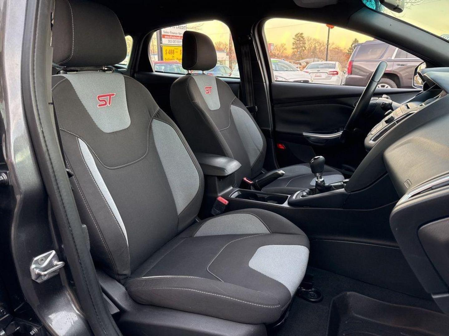 2016 GRAY Ford Focus ST (1FADP3L92GL) with an 4 Cyl, 2.0L engine, Manual transmission, located at 10890 W. Colfax Ave., Lakewood, CO, 80215, (303) 274-7692, 39.739914, -105.120132 - <b>Summary</b><br>Completley stock ST and zero signs of abuse. This is probaly the cleanest one in town. Fully serviced including new turbo and new tires. So much fun to drive! No Accidents and ready to go!<br><br><b>Vehicle Details</b><br>Discover the 2016 Ford Focus ST, a dynamic blend of performa - Photo#12