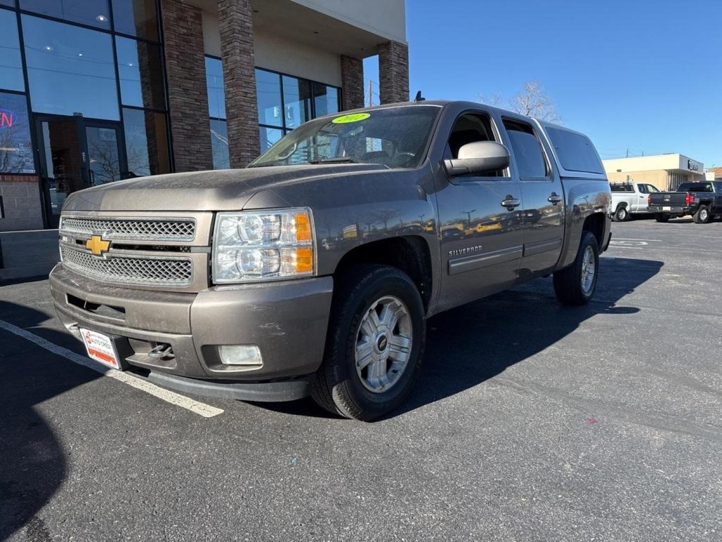 2012 Mocha Steel Metallic /Ebony Chevrolet Silverado 1500 LT (3GCPKSE76CG) with an Vortec 5.3L V8 SFI VVT Flex Fuel engine, Automatic transmission, located at 10890 W. Colfax Ave., Lakewood, CO, 80215, (303) 274-7692, 39.739914, -105.120132 - 2012 Chevrolet Silverado 1500 4WD Z71 <br><br>All Cars Have Clean Titles And Are Serviced Before Sale., 6-Speed Automatic Electronic with Overdrive, 4WD, Ebony Cloth, 18'' x 8'' Aluminum Wheels, Body-Colored Door Handles, Body-Colored Grille w/Unique Chrome Insert, Front Chrome Recovery Hooks, Heate - Photo#0