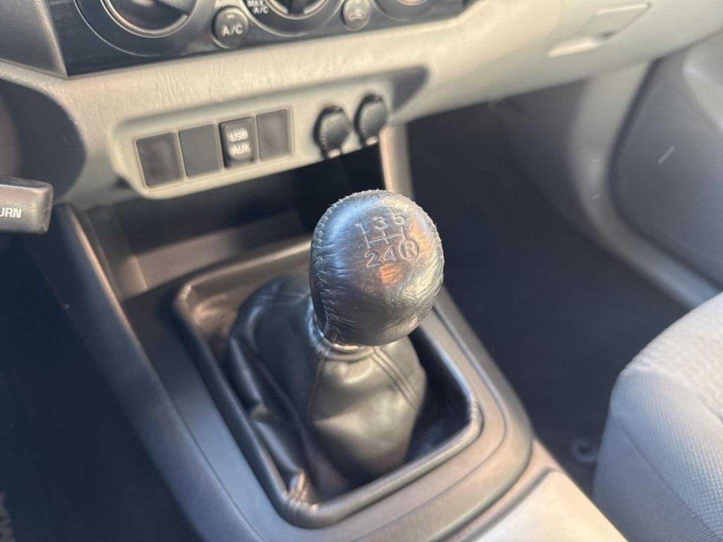 2012 Barcelona Red Metallic /Graphite Toyota Tacoma SR5 (5TFUX4EN6CX) with an 2.7L I4 DOHC 16V engine, Manual transmission, located at 10890 W. Colfax Ave., Lakewood, CO, 80215, (303) 274-7692, 39.739914, -105.120132 - 2012 Toyota Tacoma 4x4, manual transmission, 4cyl that is a 9.7 out of 10 condition wise. Non smoker, no rust and nicely equipped with SR5 package. You will not find a nicer one anywhere. <br><br>All Cars Have Clean Titles And Are Serviced Before Sale., Backup Camera, Non Smoker, No Pet Odor Or Hair - Photo#9