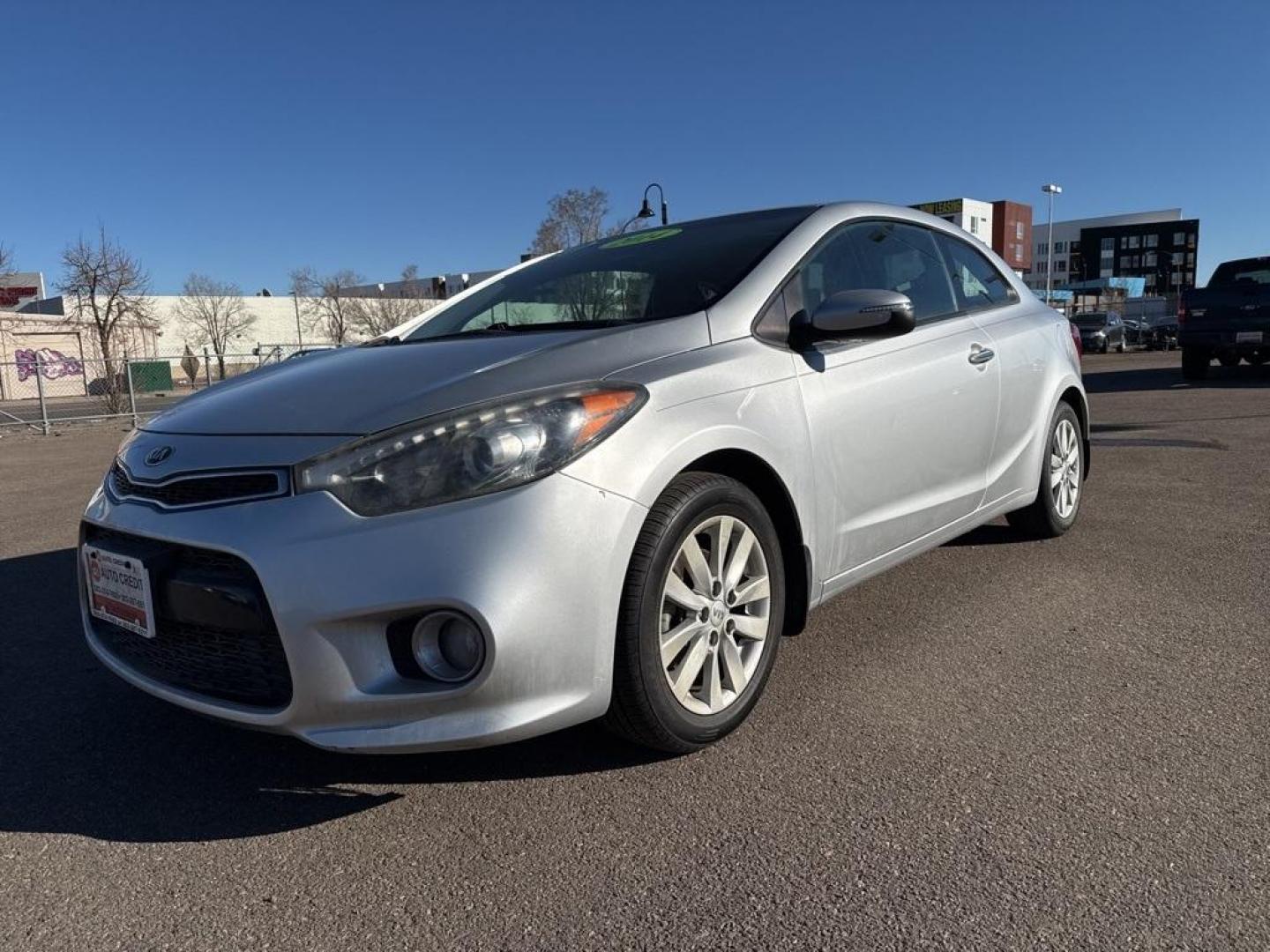 2014 Bright Silver /Black Kia Forte Koup EX (KNAFX6A8XE5) with an 2.0L I4 DOHC CVVT engine, Automatic transmission, located at 10890 W. Colfax Ave., Lakewood, CO, 80215, (303) 274-7692, 39.739914, -105.120132 - 2014 Kia Forte Koup FWD<br><br>D1 Auto NEVER charges dealer fees! All cars have clean titles and have been inspected for mechanical issues. We have financing for everyone. Good credit, bad credit, first time buyers.<br><br>Please call Lakewood Location 303-274-7692 or Thornton 303-287-5511 to schedu - Photo#0
