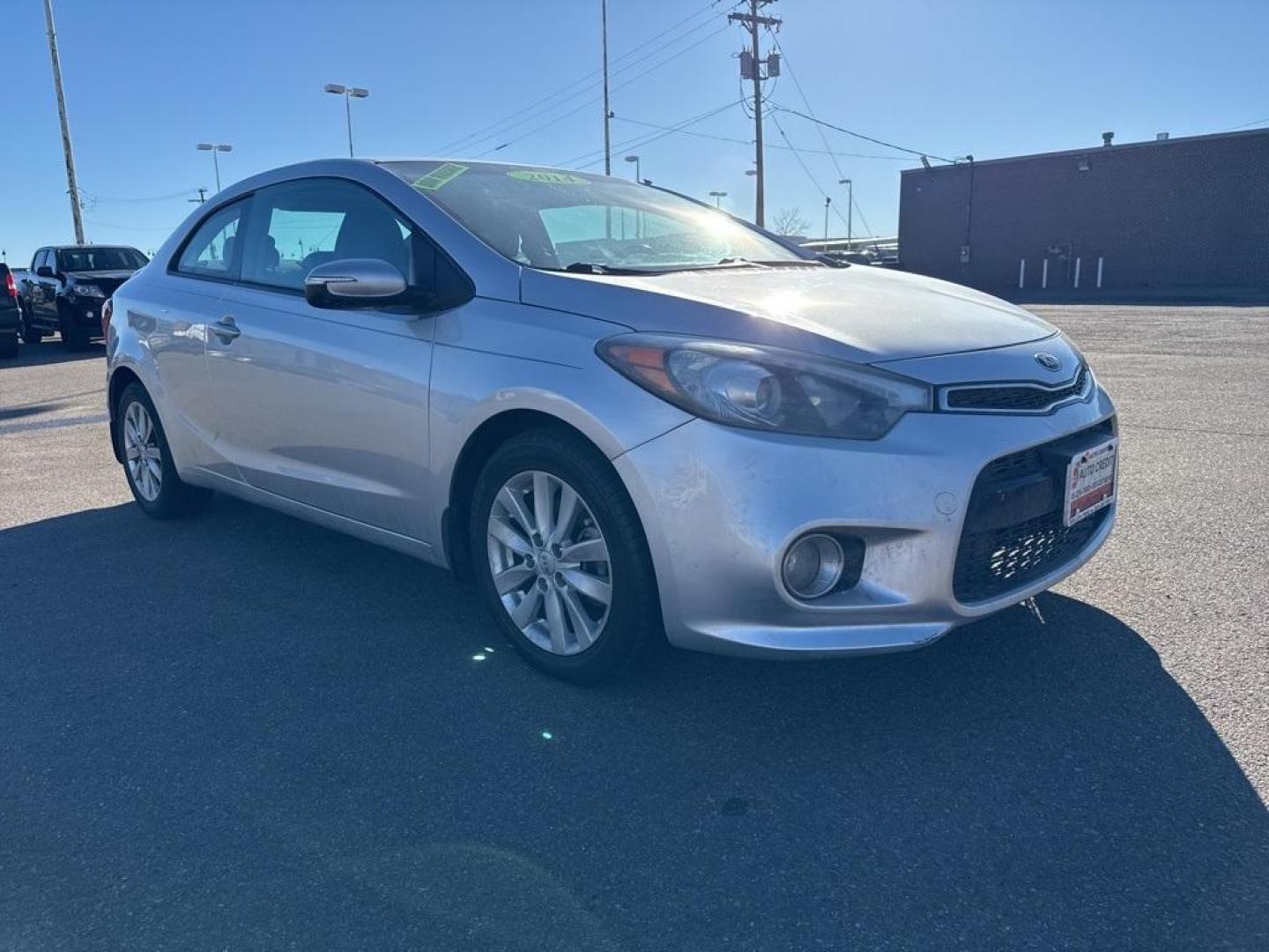 2014 Bright Silver /Black Kia Forte Koup EX (KNAFX6A8XE5) with an 2.0L I4 DOHC CVVT engine, Automatic transmission, located at 10890 W. Colfax Ave., Lakewood, CO, 80215, (303) 274-7692, 39.739914, -105.120132 - 2014 Kia Forte Koup FWD<br><br>D1 Auto NEVER charges dealer fees! All cars have clean titles and have been inspected for mechanical issues. We have financing for everyone. Good credit, bad credit, first time buyers.<br><br>Please call Lakewood Location 303-274-7692 or Thornton 303-287-5511 to schedu - Photo#2
