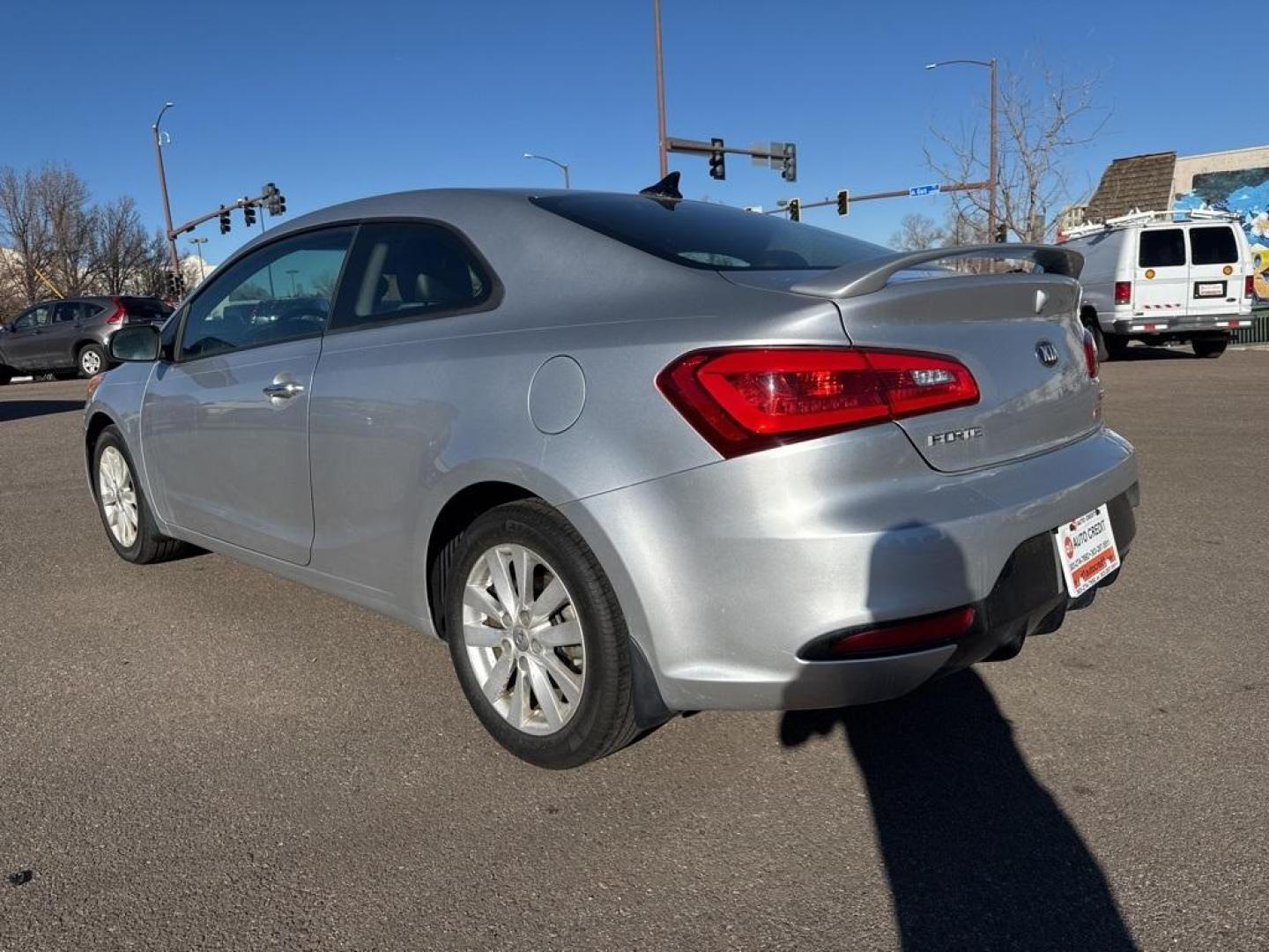2014 Bright Silver /Black Kia Forte Koup EX (KNAFX6A8XE5) with an 2.0L I4 DOHC CVVT engine, Automatic transmission, located at 10890 W. Colfax Ave., Lakewood, CO, 80215, (303) 274-7692, 39.739914, -105.120132 - 2014 Kia Forte Koup FWD<br><br>D1 Auto NEVER charges dealer fees! All cars have clean titles and have been inspected for mechanical issues. We have financing for everyone. Good credit, bad credit, first time buyers.<br><br>Please call Lakewood Location 303-274-7692 or Thornton 303-287-5511 to schedu - Photo#6