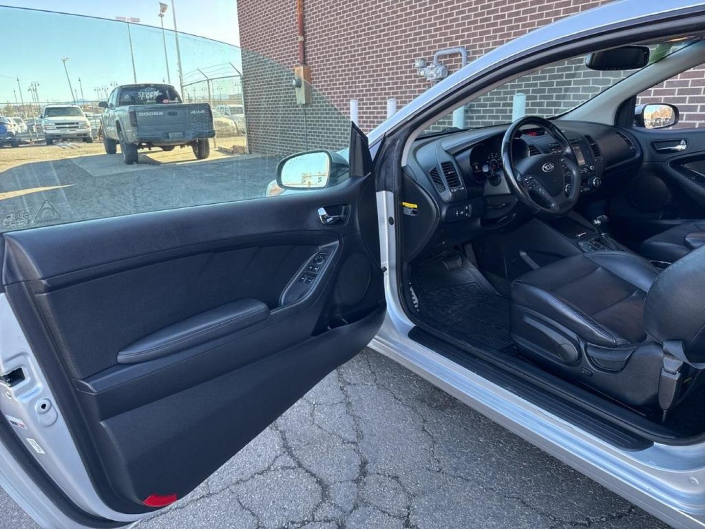 2014 Bright Silver /Black Kia Forte Koup EX (KNAFX6A8XE5) with an 2.0L I4 DOHC CVVT engine, Automatic transmission, located at 10890 W. Colfax Ave., Lakewood, CO, 80215, (303) 274-7692, 39.739914, -105.120132 - 2014 Kia Forte Koup FWD<br><br>D1 Auto NEVER charges dealer fees! All cars have clean titles and have been inspected for mechanical issues. We have financing for everyone. Good credit, bad credit, first time buyers.<br><br>Please call Lakewood Location 303-274-7692 or Thornton 303-287-5511 to schedu - Photo#19