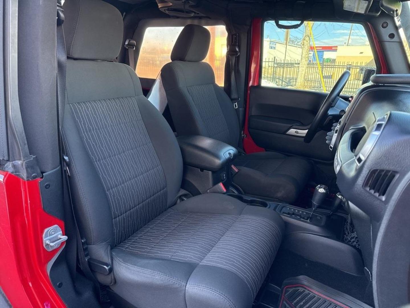 2011 RED /BLACK Jeep Wrangler Rubicon (1J4BA6D11BL) with an V6, 3.8L engine, Automatic transmission, located at 10890 W. Colfax Ave., Lakewood, CO, 80215, (303) 274-7692, 39.739914, -105.120132 - Get ready for adventure with this 2011 Jeep Wrangler Rubicon, a true icon of off-road prowess and rugged style. This trail-ready beast is equipped with a robust 4WD system and a powerful V6, 3.8L engine that promises an exhilarating drive, whether you're navigating city streets or tackling rugged tr - Photo#48
