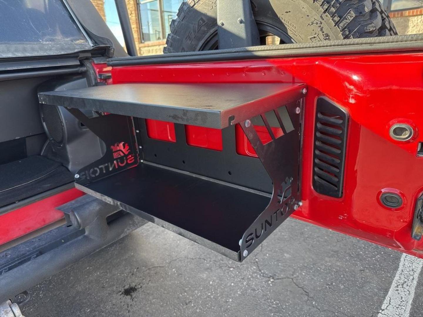 2011 RED /BLACK Jeep Wrangler Rubicon (1J4BA6D11BL) with an V6, 3.8L engine, Automatic transmission, located at 10890 W. Colfax Ave., Lakewood, CO, 80215, (303) 274-7692, 39.739914, -105.120132 - Get ready for adventure with this 2011 Jeep Wrangler Rubicon, a true icon of off-road prowess and rugged style. This trail-ready beast is equipped with a robust 4WD system and a powerful V6, 3.8L engine that promises an exhilarating drive, whether you're navigating city streets or tackling rugged tr - Photo#50