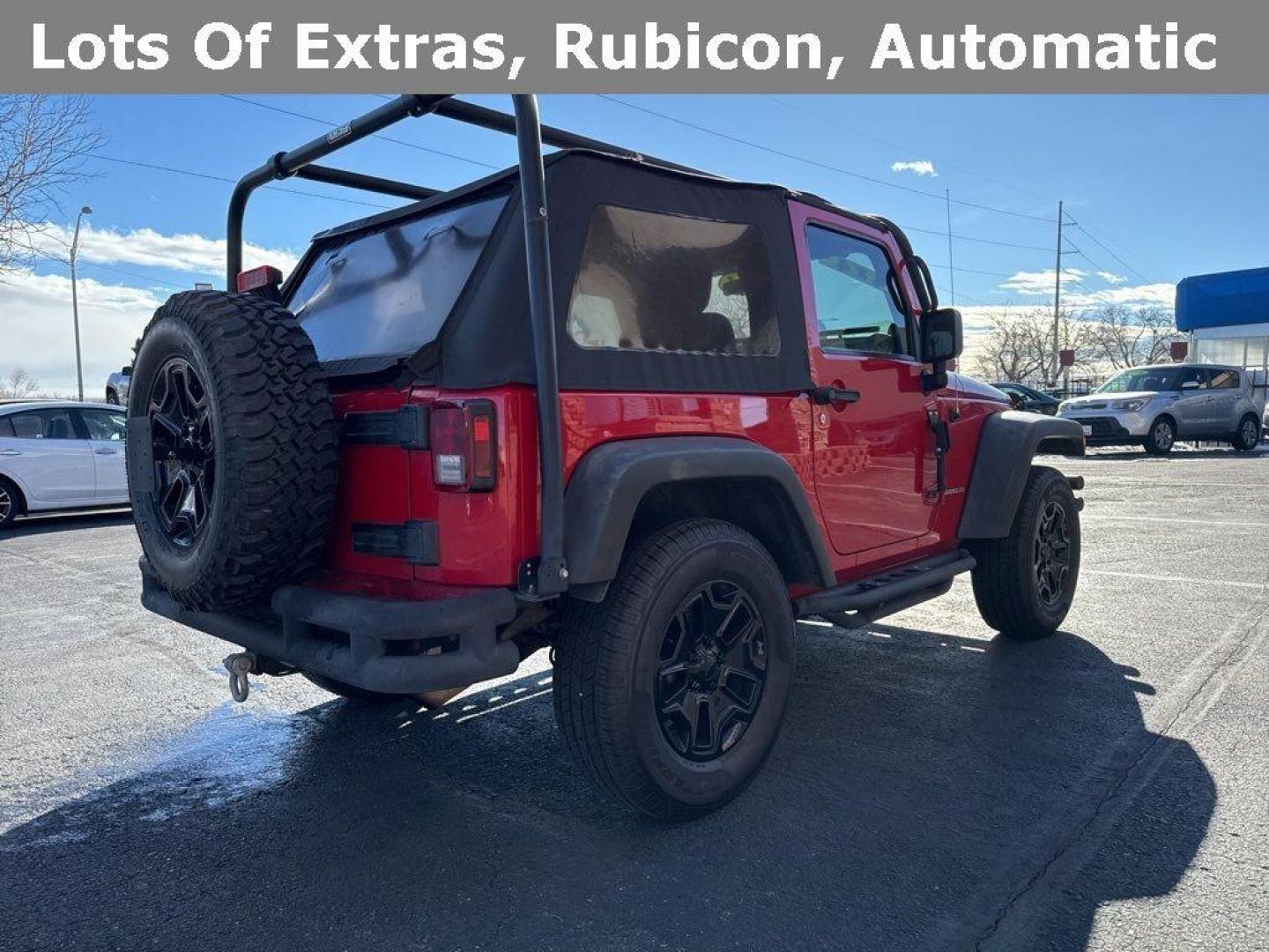 2011 RED /BLACK Jeep Wrangler Rubicon (1J4BA6D11BL) with an V6, 3.8L engine, Automatic transmission, located at 10890 W. Colfax Ave., Lakewood, CO, 80215, (303) 274-7692, 39.739914, -105.120132 - Get ready for adventure with this 2011 Jeep Wrangler Rubicon, a true icon of off-road prowess and rugged style. This trail-ready beast is equipped with a robust 4WD system and a powerful V6, 3.8L engine that promises an exhilarating drive, whether you're navigating city streets or tackling rugged tr - Photo#5
