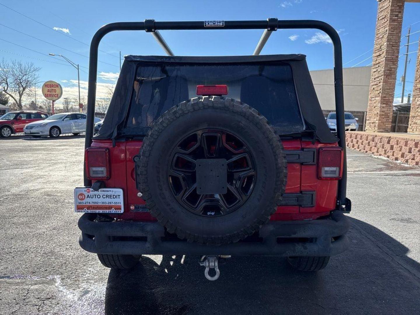 2011 RED /BLACK Jeep Wrangler Rubicon (1J4BA6D11BL) with an V6, 3.8L engine, Automatic transmission, located at 10890 W. Colfax Ave., Lakewood, CO, 80215, (303) 274-7692, 39.739914, -105.120132 - Get ready for adventure with this 2011 Jeep Wrangler Rubicon, a true icon of off-road prowess and rugged style. This trail-ready beast is equipped with a robust 4WD system and a powerful V6, 3.8L engine that promises an exhilarating drive, whether you're navigating city streets or tackling rugged tr - Photo#6