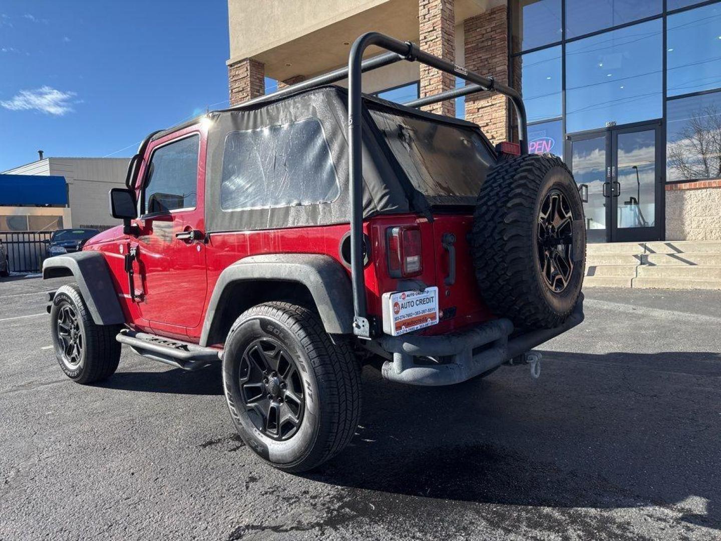 2011 RED /BLACK Jeep Wrangler Rubicon (1J4BA6D11BL) with an V6, 3.8L engine, Automatic transmission, located at 10890 W. Colfax Ave., Lakewood, CO, 80215, (303) 274-7692, 39.739914, -105.120132 - Get ready for adventure with this 2011 Jeep Wrangler Rubicon, a true icon of off-road prowess and rugged style. This trail-ready beast is equipped with a robust 4WD system and a powerful V6, 3.8L engine that promises an exhilarating drive, whether you're navigating city streets or tackling rugged tr - Photo#7
