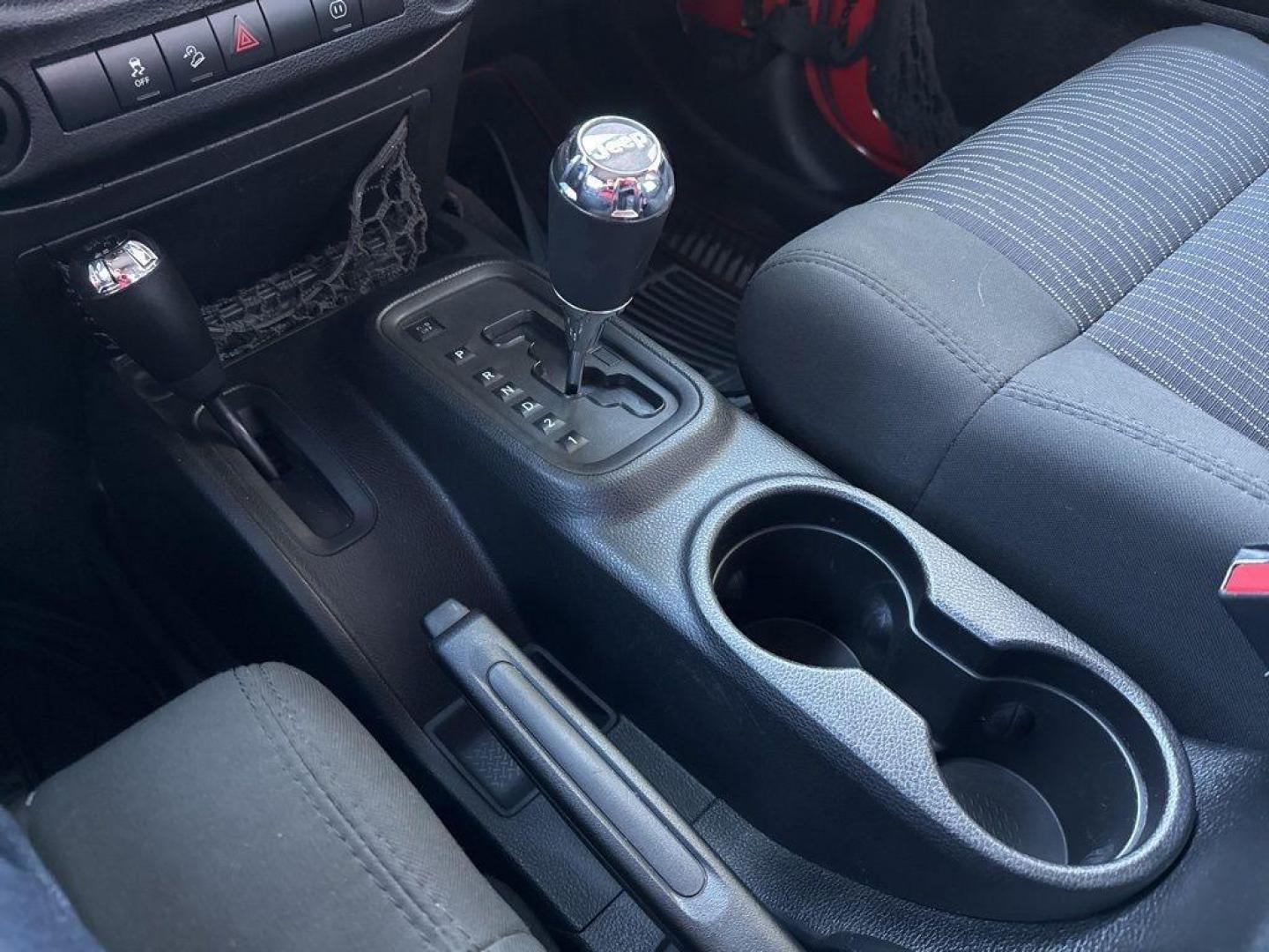 2011 RED /BLACK Jeep Wrangler Rubicon (1J4BA6D11BL) with an V6, 3.8L engine, Automatic transmission, located at 10890 W. Colfax Ave., Lakewood, CO, 80215, (303) 274-7692, 39.739914, -105.120132 - Get ready for adventure with this 2011 Jeep Wrangler Rubicon, a true icon of off-road prowess and rugged style. This trail-ready beast is equipped with a robust 4WD system and a powerful V6, 3.8L engine that promises an exhilarating drive, whether you're navigating city streets or tackling rugged tr - Photo#11