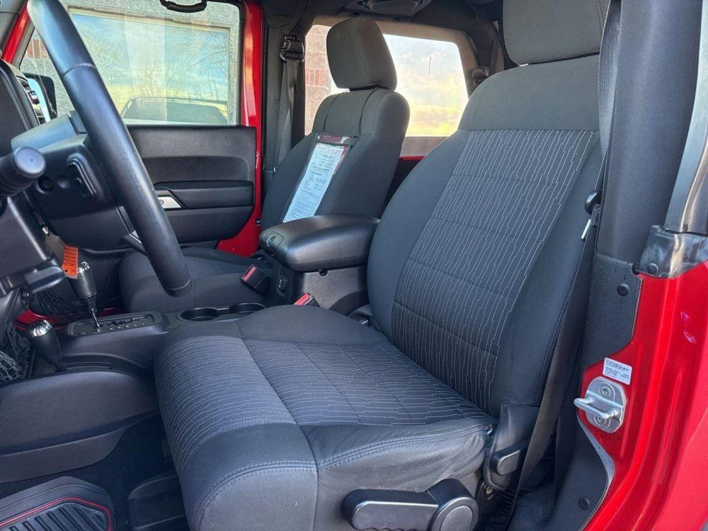 2011 RED /BLACK Jeep Wrangler Rubicon (1J4BA6D11BL) with an V6, 3.8L engine, Automatic transmission, located at 10890 W. Colfax Ave., Lakewood, CO, 80215, (303) 274-7692, 39.739914, -105.120132 - Get ready for adventure with this 2011 Jeep Wrangler Rubicon, a true icon of off-road prowess and rugged style. This trail-ready beast is equipped with a robust 4WD system and a powerful V6, 3.8L engine that promises an exhilarating drive, whether you're navigating city streets or tackling rugged tr - Photo#14
