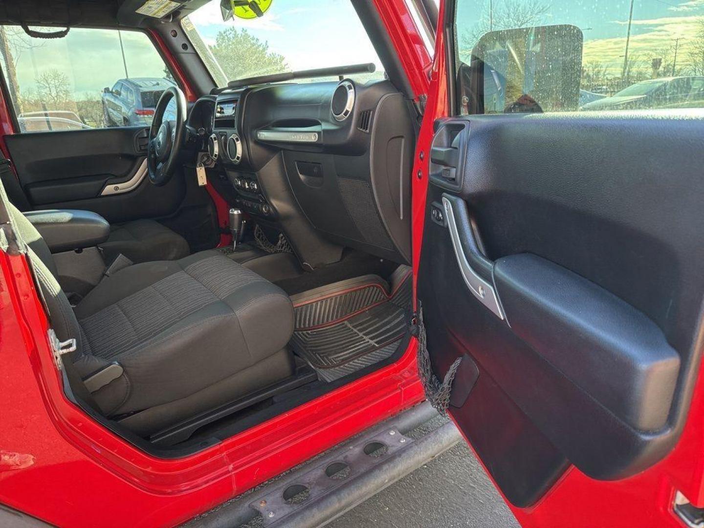 2011 RED /BLACK Jeep Wrangler Rubicon (1J4BA6D11BL) with an V6, 3.8L engine, Automatic transmission, located at 10890 W. Colfax Ave., Lakewood, CO, 80215, (303) 274-7692, 39.739914, -105.120132 - Get ready for adventure with this 2011 Jeep Wrangler Rubicon, a true icon of off-road prowess and rugged style. This trail-ready beast is equipped with a robust 4WD system and a powerful V6, 3.8L engine that promises an exhilarating drive, whether you're navigating city streets or tackling rugged tr - Photo#20