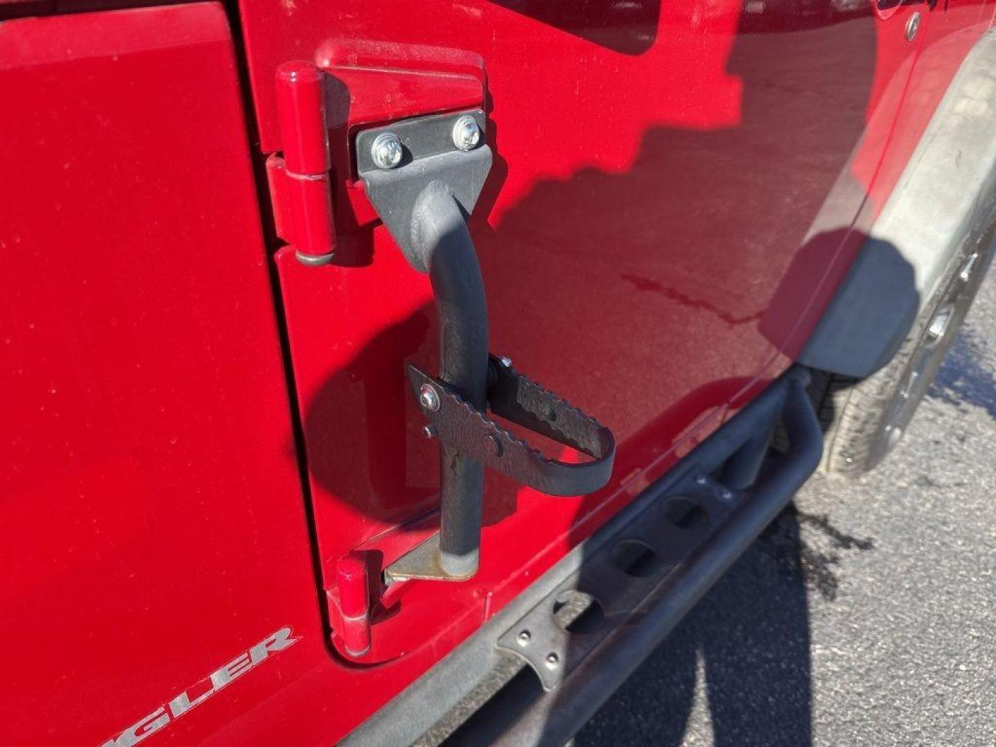 2011 RED /BLACK Jeep Wrangler Rubicon (1J4BA6D11BL) with an V6, 3.8L engine, Automatic transmission, located at 10890 W. Colfax Ave., Lakewood, CO, 80215, (303) 274-7692, 39.739914, -105.120132 - Get ready for adventure with this 2011 Jeep Wrangler Rubicon, a true icon of off-road prowess and rugged style. This trail-ready beast is equipped with a robust 4WD system and a powerful V6, 3.8L engine that promises an exhilarating drive, whether you're navigating city streets or tackling rugged tr - Photo#21
