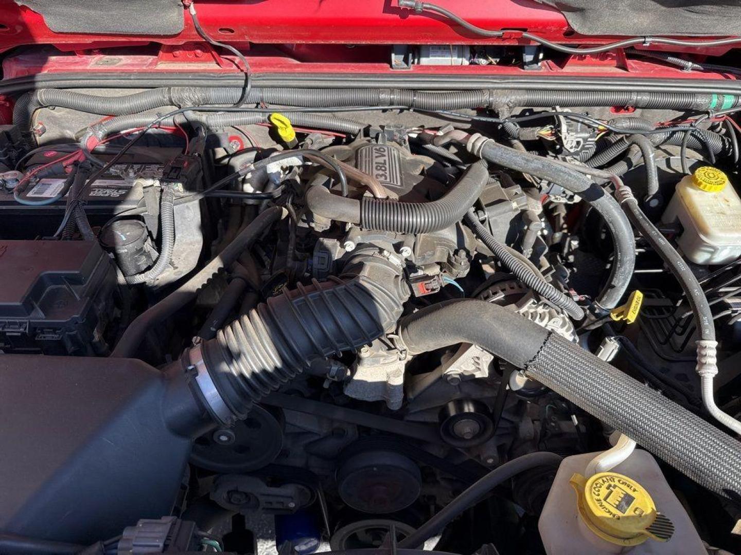 2011 RED /BLACK Jeep Wrangler Rubicon (1J4BA6D11BL) with an V6, 3.8L engine, Automatic transmission, located at 10890 W. Colfax Ave., Lakewood, CO, 80215, (303) 274-7692, 39.739914, -105.120132 - Get ready for adventure with this 2011 Jeep Wrangler Rubicon, a true icon of off-road prowess and rugged style. This trail-ready beast is equipped with a robust 4WD system and a powerful V6, 3.8L engine that promises an exhilarating drive, whether you're navigating city streets or tackling rugged tr - Photo#25