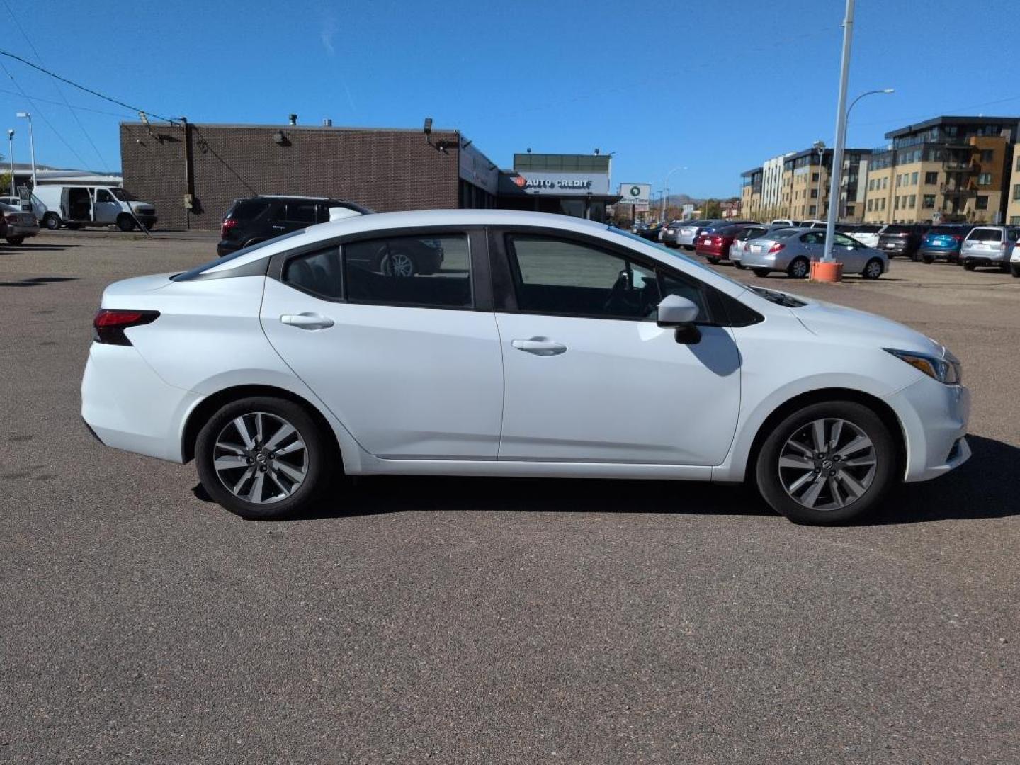 2022 WHITE /ACTUAL Nissan Versa SV (3N1CN8EV9NL) with an 4 Cyl, 1.6L engine, Automatic transmission, located at 10890 W. Colfax Ave., Lakewood, CO, 80215, (303) 274-7692, 39.739914, -105.120132 - Discover the perfect blend of style, efficiency, and reliability with this 2022 Nissan Versa SV. This compact sedan is ideal for those seeking an economical yet comfortable driving experience. Equipped with a 4-cylinder, 1.6L engine and front-wheel drive, this vehicle ensures a smooth, responsive ri - Photo#3
