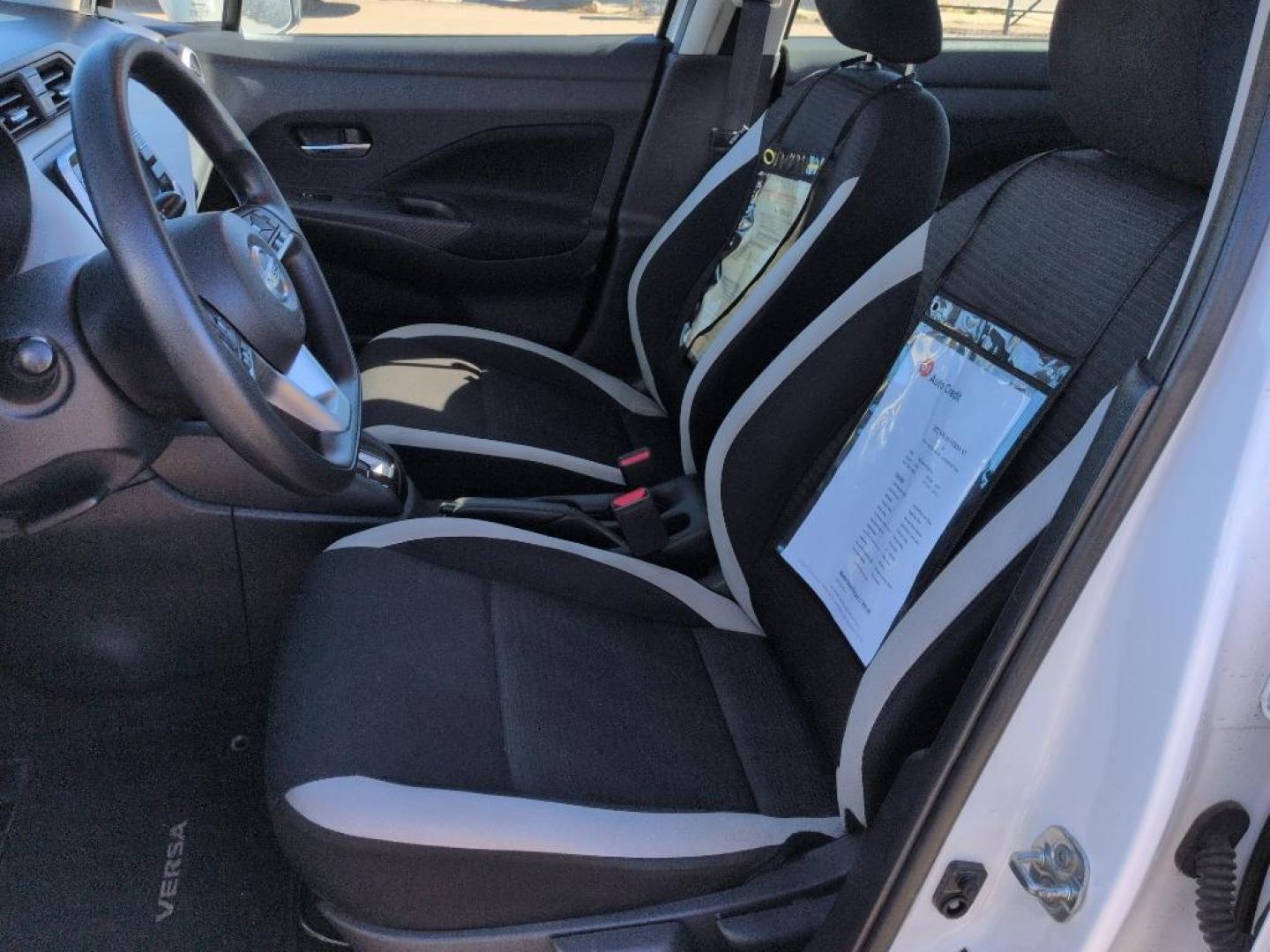 2022 WHITE /ACTUAL Nissan Versa SV (3N1CN8EV9NL) with an 4 Cyl, 1.6L engine, Automatic transmission, located at 10890 W. Colfax Ave., Lakewood, CO, 80215, (303) 274-7692, 39.739914, -105.120132 - Discover the perfect blend of style, efficiency, and reliability with this 2022 Nissan Versa SV. This compact sedan is ideal for those seeking an economical yet comfortable driving experience. Equipped with a 4-cylinder, 1.6L engine and front-wheel drive, this vehicle ensures a smooth, responsive ri - Photo#9