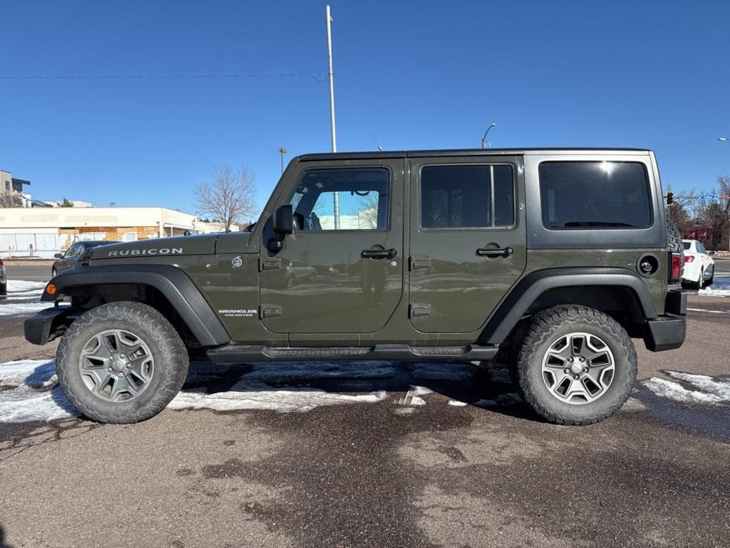 2015 Tank Clearcoat /Black Jeep Wrangler Unlimited Rubicon (1C4BJWFG7FL) with an 3.6L V6 24V VVT engine, Manual transmission, located at 10890 W. Colfax Ave., Lakewood, CO, 80215, (303) 274-7692, 39.739914, -105.120132 - 2015 Jeep Wrangler 4WD All Cars Have Clean Titles And Are Serviced Before Sale., Clean Carfax, No Accident, Non Smoker, 3.6L V6 24V VVT, 6-Speed Manual, 4WD, Body Color 3-Piece Hard Top.<br><br>D1 Auto NEVER charges dealer fees! All cars have clean titles and have been inspected for mechanical issue - Photo#7