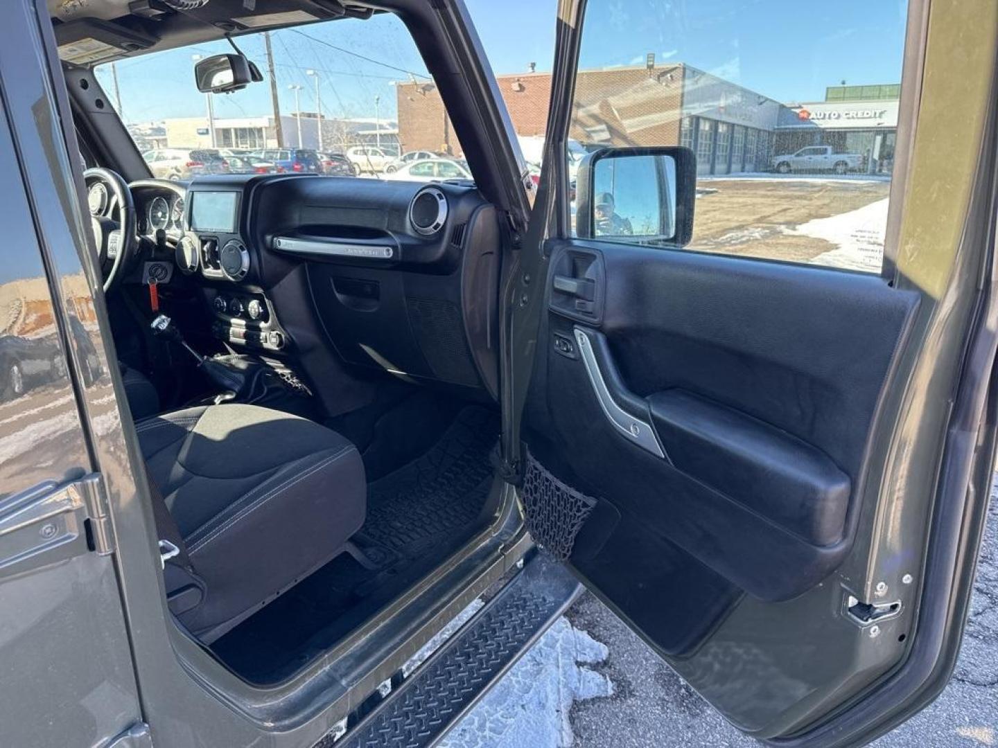 2015 Tank Clearcoat /Black Jeep Wrangler Unlimited Rubicon (1C4BJWFG7FL) with an 3.6L V6 24V VVT engine, Manual transmission, located at 10890 W. Colfax Ave., Lakewood, CO, 80215, (303) 274-7692, 39.739914, -105.120132 - 2015 Jeep Wrangler 4WD All Cars Have Clean Titles And Are Serviced Before Sale., Clean Carfax, No Accident, Non Smoker, 3.6L V6 24V VVT, 6-Speed Manual, 4WD, Body Color 3-Piece Hard Top.<br><br>D1 Auto NEVER charges dealer fees! All cars have clean titles and have been inspected for mechanical issue - Photo#8