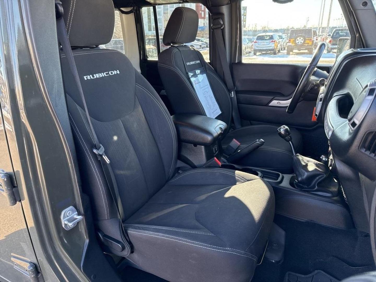 2015 Tank Clearcoat /Black Jeep Wrangler Unlimited Rubicon (1C4BJWFG7FL) with an 3.6L V6 24V VVT engine, Manual transmission, located at 10890 W. Colfax Ave., Lakewood, CO, 80215, (303) 274-7692, 39.739914, -105.120132 - 2015 Jeep Wrangler 4WD All Cars Have Clean Titles And Are Serviced Before Sale., Clean Carfax, No Accident, Non Smoker, 3.6L V6 24V VVT, 6-Speed Manual, 4WD, Body Color 3-Piece Hard Top.<br><br>D1 Auto NEVER charges dealer fees! All cars have clean titles and have been inspected for mechanical issue - Photo#9