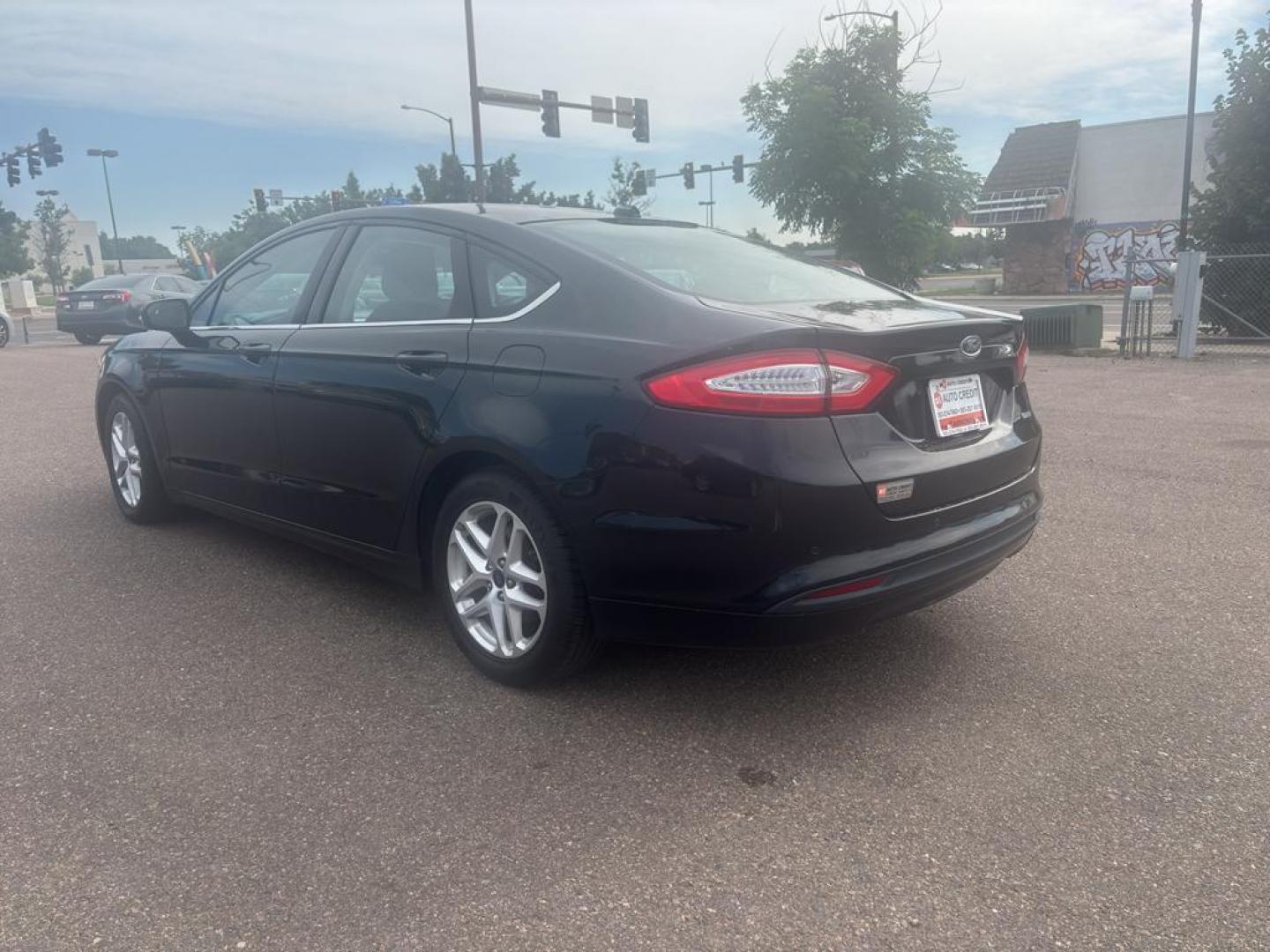 2013 BLACK Ford Fusion SE (3FA6P0HR6DR) with an 4 Cyl, 1.6L engine, Automatic transmission, located at 10890 W. Colfax Ave., Lakewood, CO, 80215, (303) 274-7692, 39.739914, -105.120132 - Photo#5