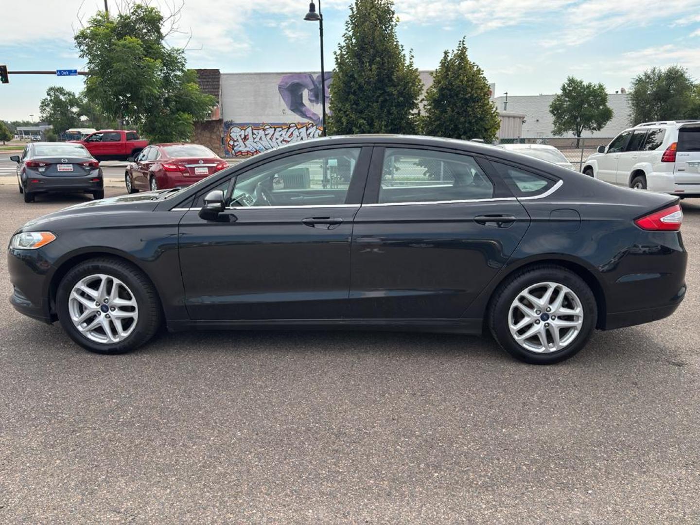 2013 BLACK Ford Fusion SE (3FA6P0HR6DR) with an 4 Cyl, 1.6L engine, Automatic transmission, located at 10890 W. Colfax Ave., Lakewood, CO, 80215, (303) 274-7692, 39.739914, -105.120132 - Photo#6
