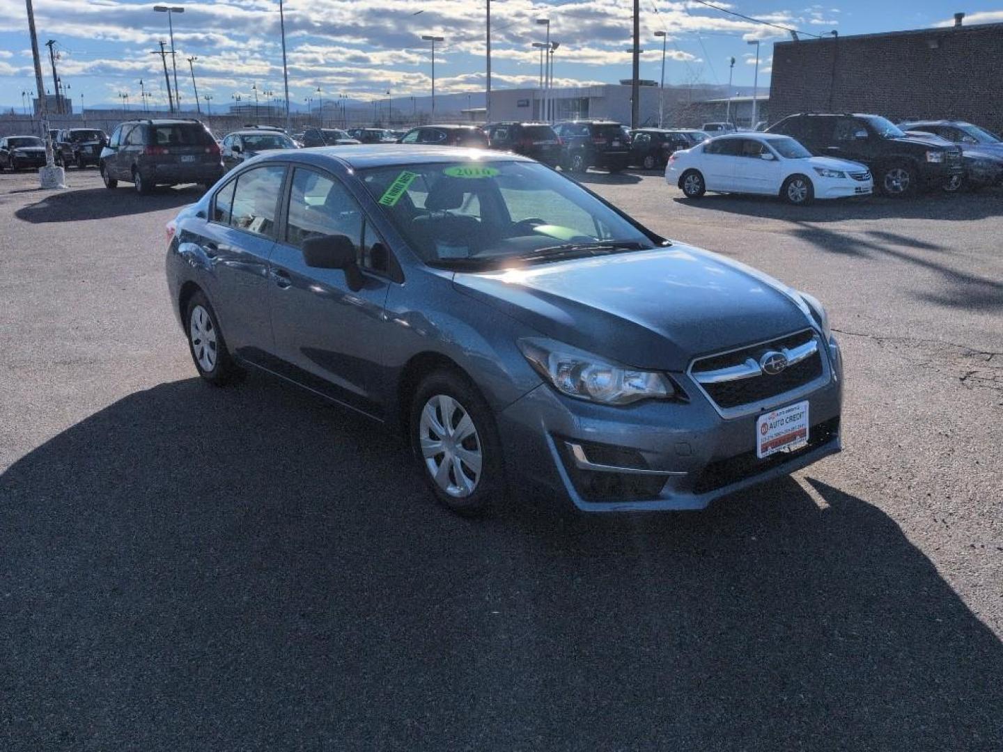 2016 BLUE Subaru Impreza Base (JF1GJAA64GG) with an 4 Cyl, 2.0L engine, Manual 5-Speed transmission, located at 10890 W. Colfax Ave., Lakewood, CO, 80215, (303) 274-7692, 39.739914, -105.120132 - Photo#2