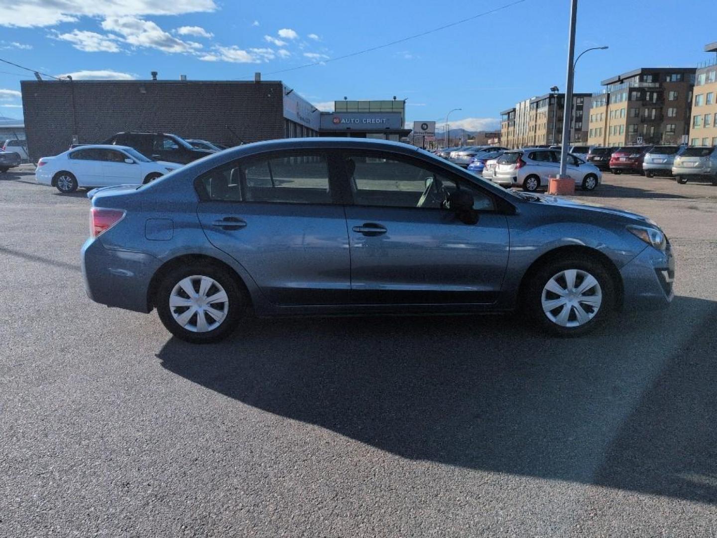 2016 BLUE Subaru Impreza Base (JF1GJAA64GG) with an 4 Cyl, 2.0L engine, Manual 5-Speed transmission, located at 10890 W. Colfax Ave., Lakewood, CO, 80215, (303) 274-7692, 39.739914, -105.120132 - Photo#3