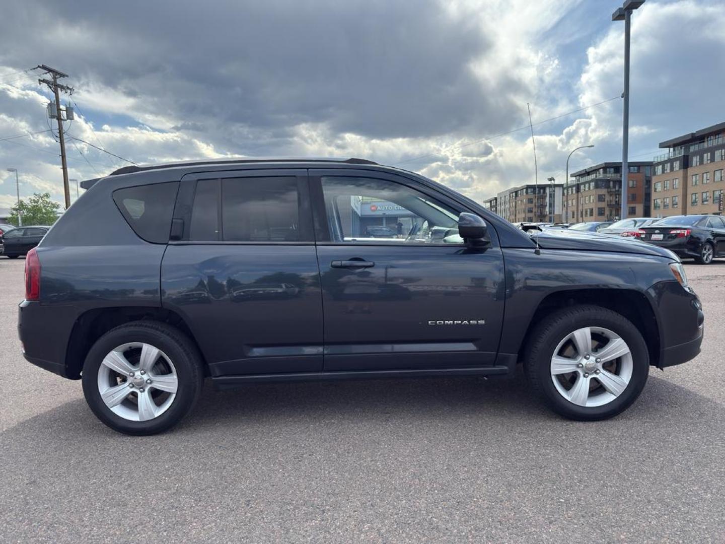 2014 GRAY Jeep Compass Sport (1C4NJDAB0ED) with an 4 Cyl, 2.4L engine, Manual transmission, located at 10890 W. Colfax Ave., Lakewood, CO, 80215, (303) 274-7692, 39.739914, -105.120132 - Discover adventure and reliability with this dynamic 2014 Jeep Compass Sport, the perfect blend of rugged capability and modern comfort! This robust SUV is ready to take you on any journey, with its dependable 4WD system ensuring confidence and control on all terrains, from city streets to off-road - Photo#3