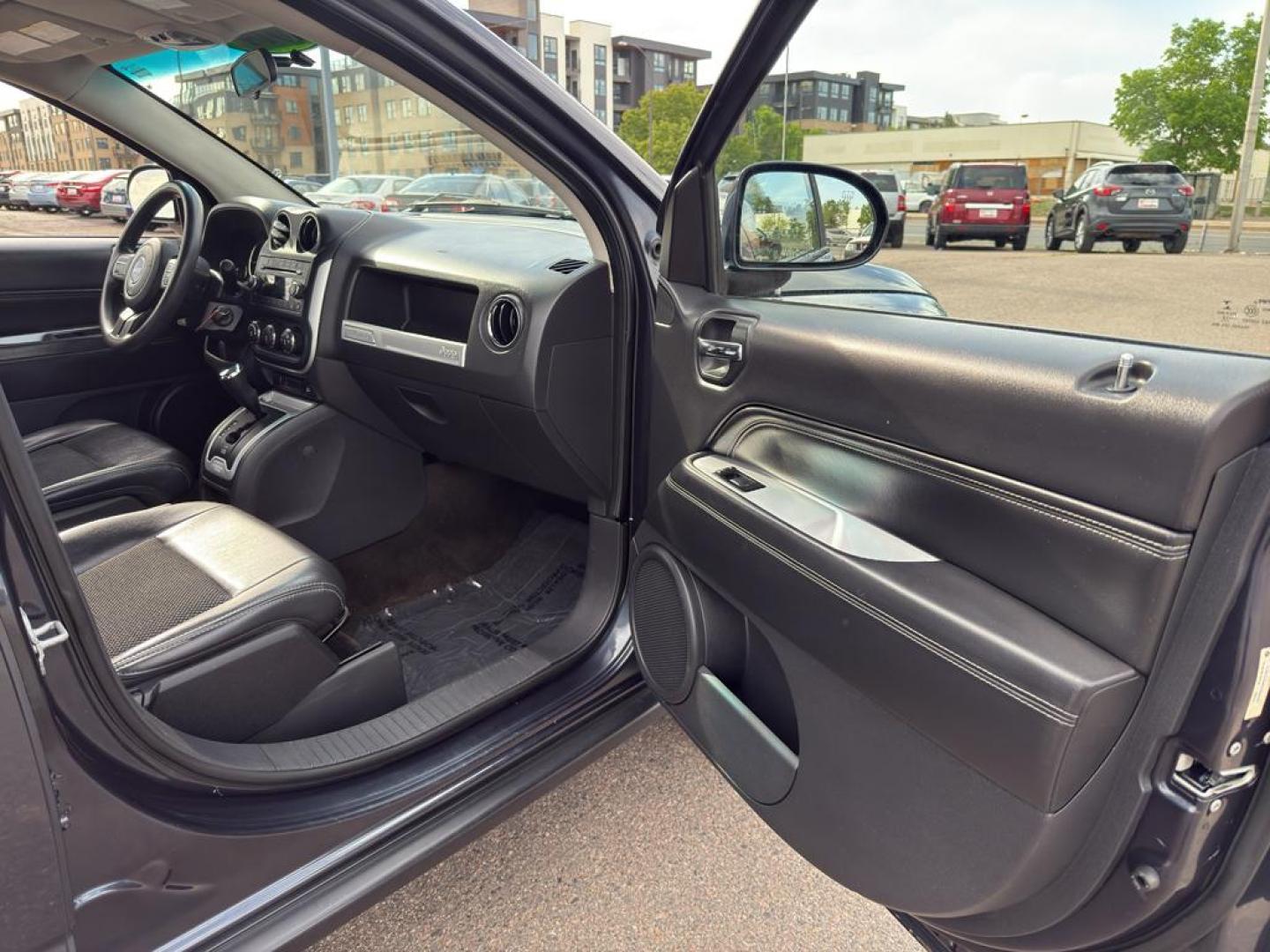 2014 GRAY Jeep Compass Sport (1C4NJDAB0ED) with an 4 Cyl, 2.4L engine, Manual transmission, located at 10890 W. Colfax Ave., Lakewood, CO, 80215, (303) 274-7692, 39.739914, -105.120132 - Discover adventure and reliability with this dynamic 2014 Jeep Compass Sport, the perfect blend of rugged capability and modern comfort! This robust SUV is ready to take you on any journey, with its dependable 4WD system ensuring confidence and control on all terrains, from city streets to off-road - Photo#8
