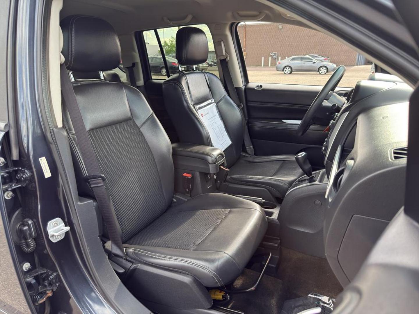 2014 GRAY Jeep Compass Sport (1C4NJDAB0ED) with an 4 Cyl, 2.4L engine, Manual transmission, located at 10890 W. Colfax Ave., Lakewood, CO, 80215, (303) 274-7692, 39.739914, -105.120132 - Discover adventure and reliability with this dynamic 2014 Jeep Compass Sport, the perfect blend of rugged capability and modern comfort! This robust SUV is ready to take you on any journey, with its dependable 4WD system ensuring confidence and control on all terrains, from city streets to off-road - Photo#9