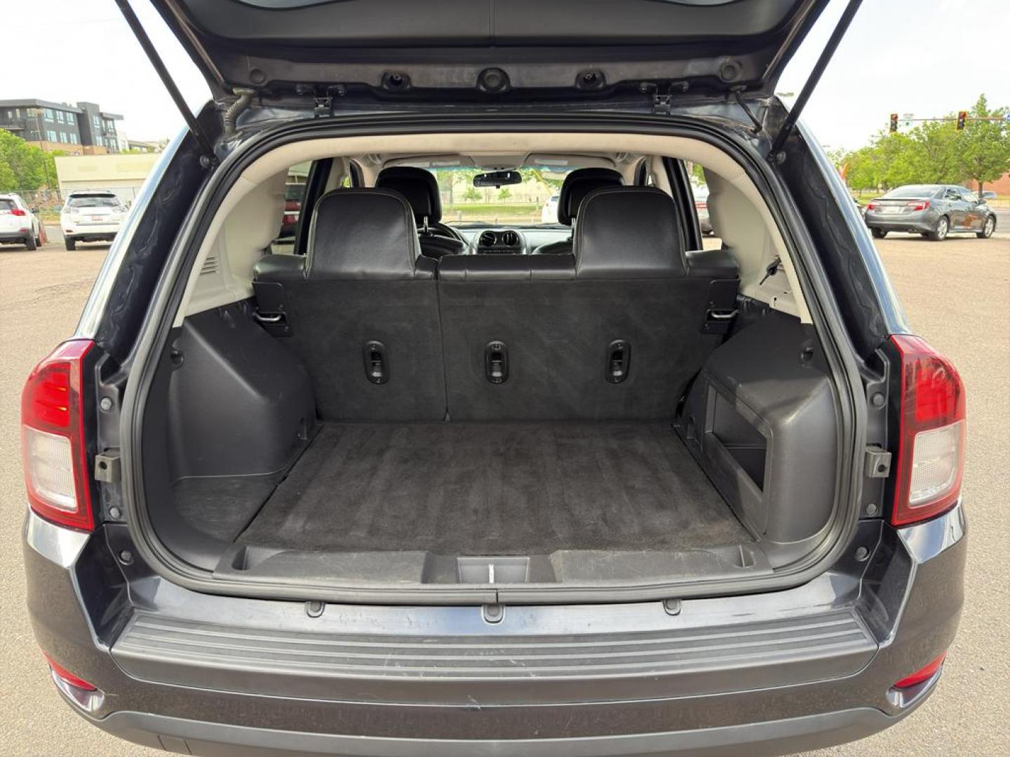 2014 GRAY Jeep Compass Sport (1C4NJDAB0ED) with an 4 Cyl, 2.4L engine, Manual transmission, located at 10890 W. Colfax Ave., Lakewood, CO, 80215, (303) 274-7692, 39.739914, -105.120132 - Discover adventure and reliability with this dynamic 2014 Jeep Compass Sport, the perfect blend of rugged capability and modern comfort! This robust SUV is ready to take you on any journey, with its dependable 4WD system ensuring confidence and control on all terrains, from city streets to off-road - Photo#12