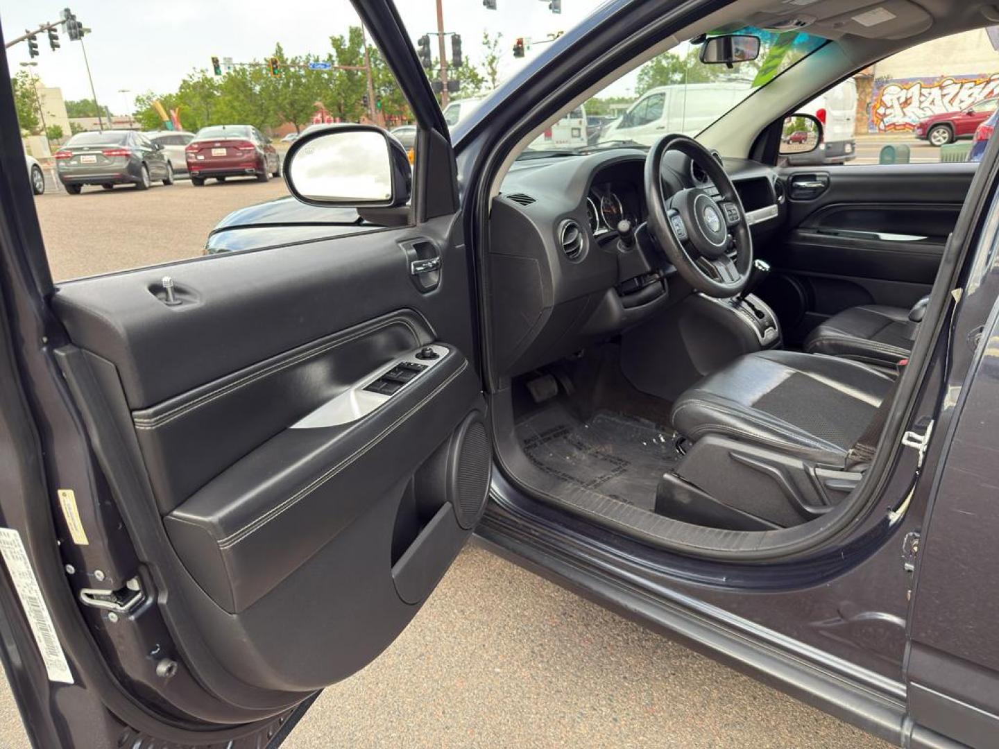 2014 GRAY Jeep Compass Sport (1C4NJDAB0ED) with an 4 Cyl, 2.4L engine, Manual transmission, located at 10890 W. Colfax Ave., Lakewood, CO, 80215, (303) 274-7692, 39.739914, -105.120132 - Discover adventure and reliability with this dynamic 2014 Jeep Compass Sport, the perfect blend of rugged capability and modern comfort! This robust SUV is ready to take you on any journey, with its dependable 4WD system ensuring confidence and control on all terrains, from city streets to off-road - Photo#15
