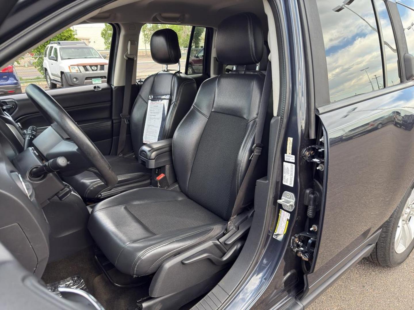 2014 GRAY Jeep Compass Sport (1C4NJDAB0ED) with an 4 Cyl, 2.4L engine, Manual transmission, located at 10890 W. Colfax Ave., Lakewood, CO, 80215, (303) 274-7692, 39.739914, -105.120132 - Discover adventure and reliability with this dynamic 2014 Jeep Compass Sport, the perfect blend of rugged capability and modern comfort! This robust SUV is ready to take you on any journey, with its dependable 4WD system ensuring confidence and control on all terrains, from city streets to off-road - Photo#16